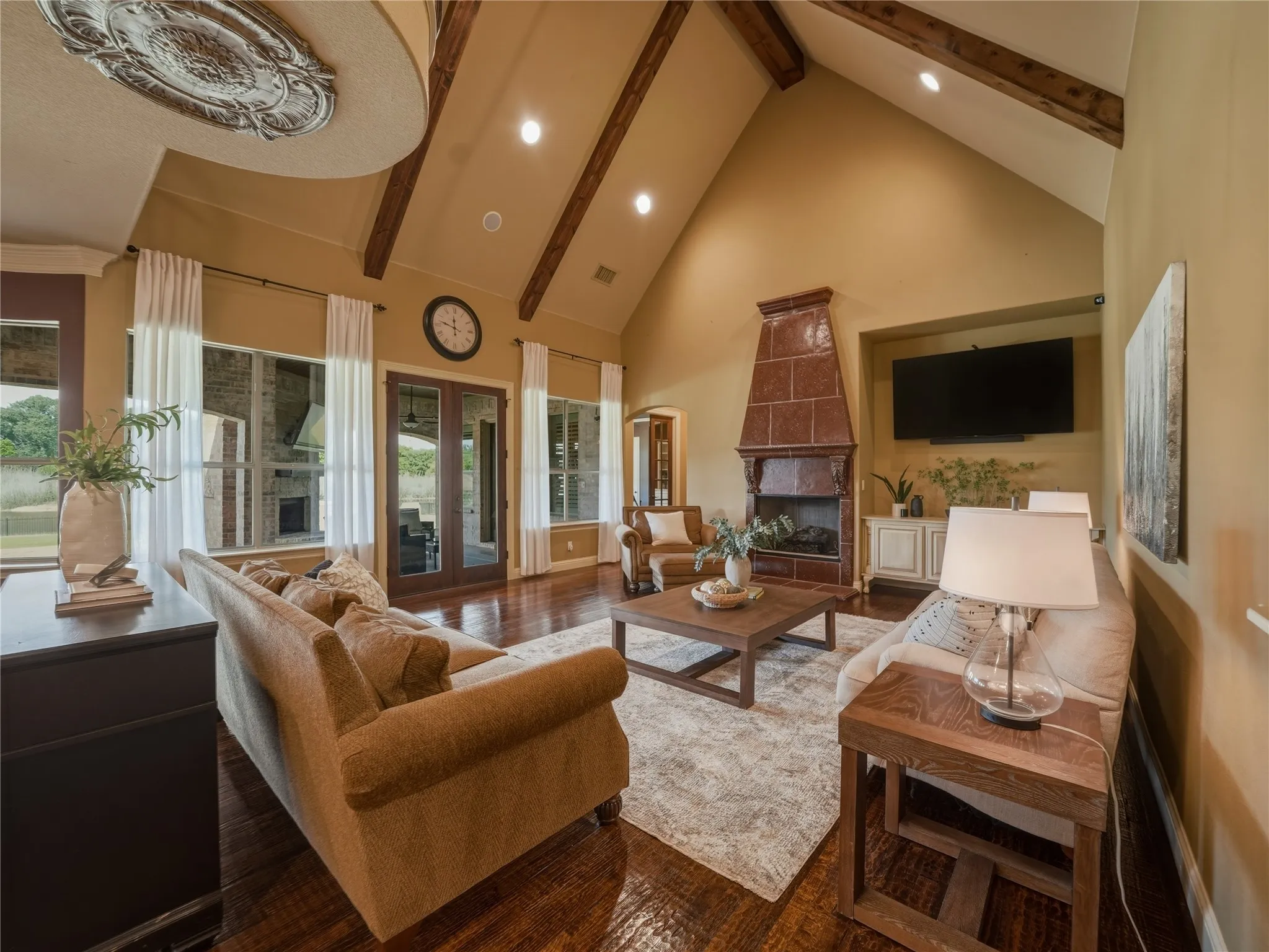 cast stone fireplace & wood beams