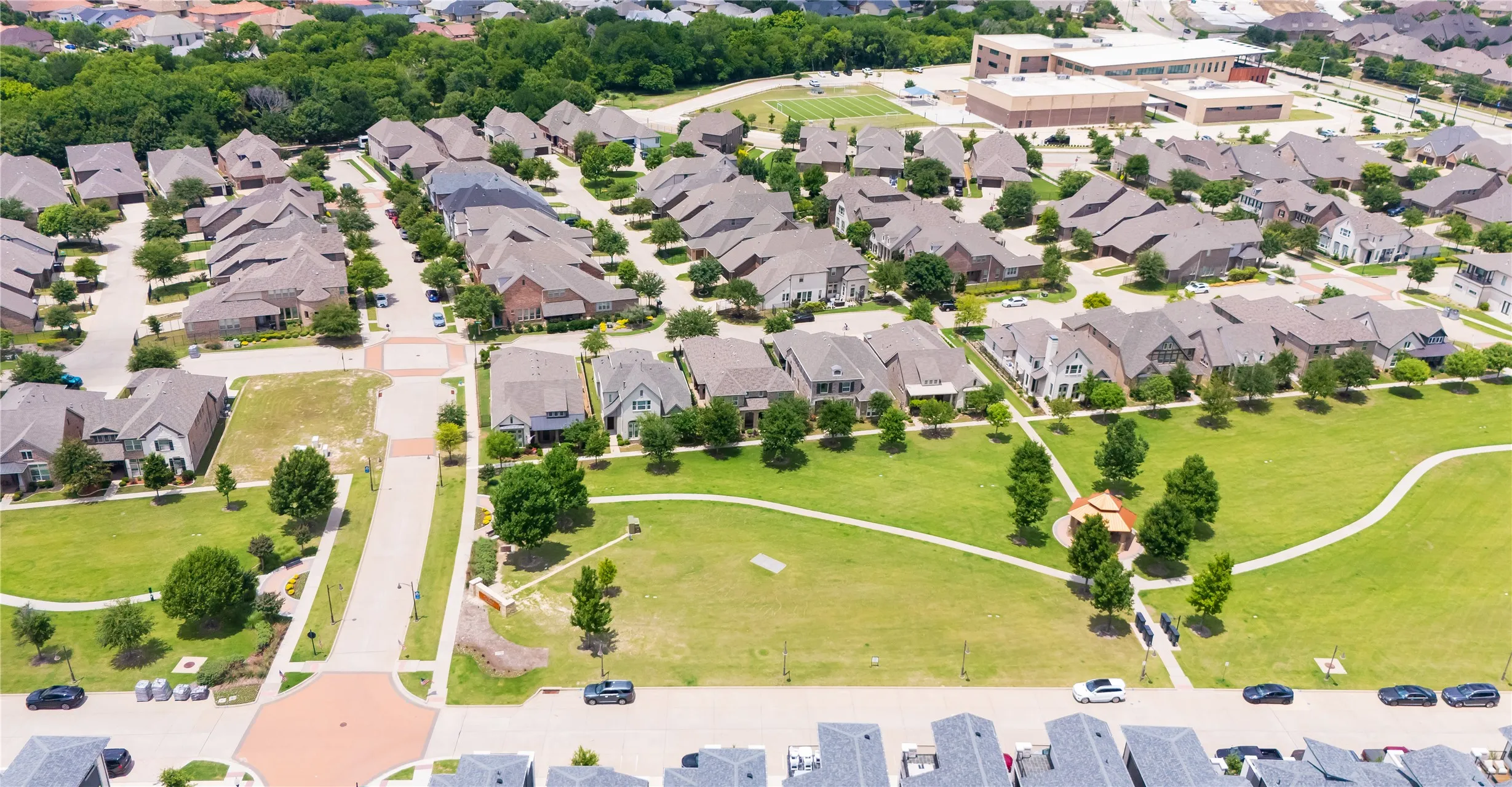 Aerial perspective showcasing a residential community with abundant green spaces