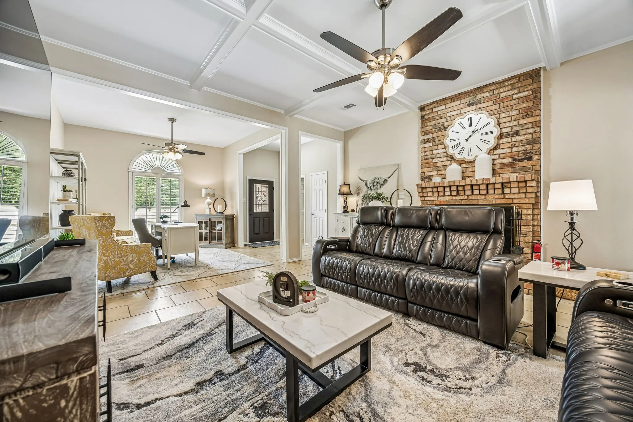 This view of the living room shows the entry. Notice the beautiful wood with glass front door!