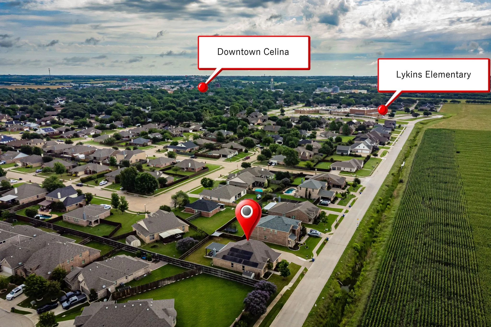 Aerial view showcasing a residential neighborhood with established homes and green spaces