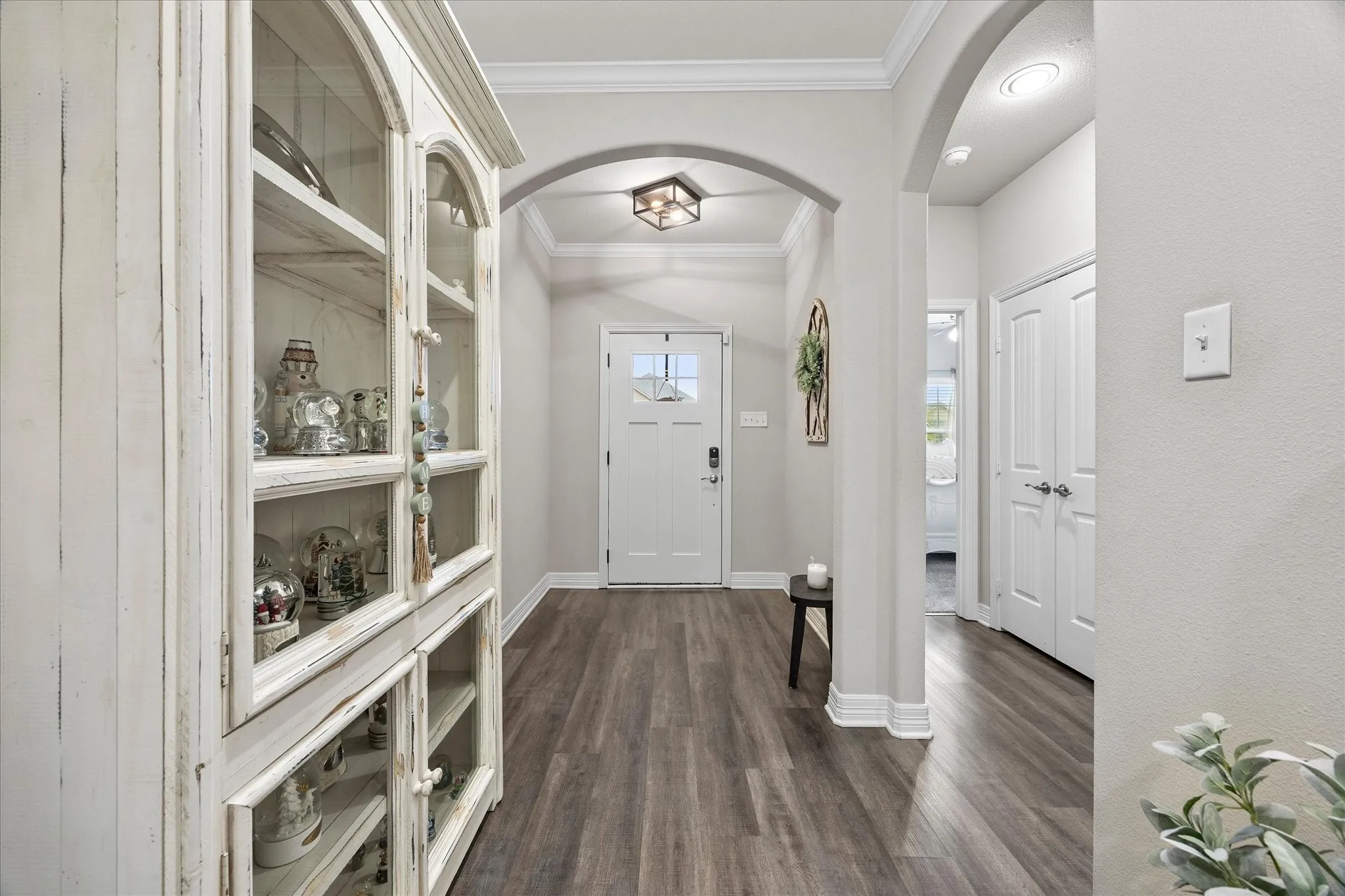 Arched doorways, crown molding and high ceilings are only a few of this home's many amenities.