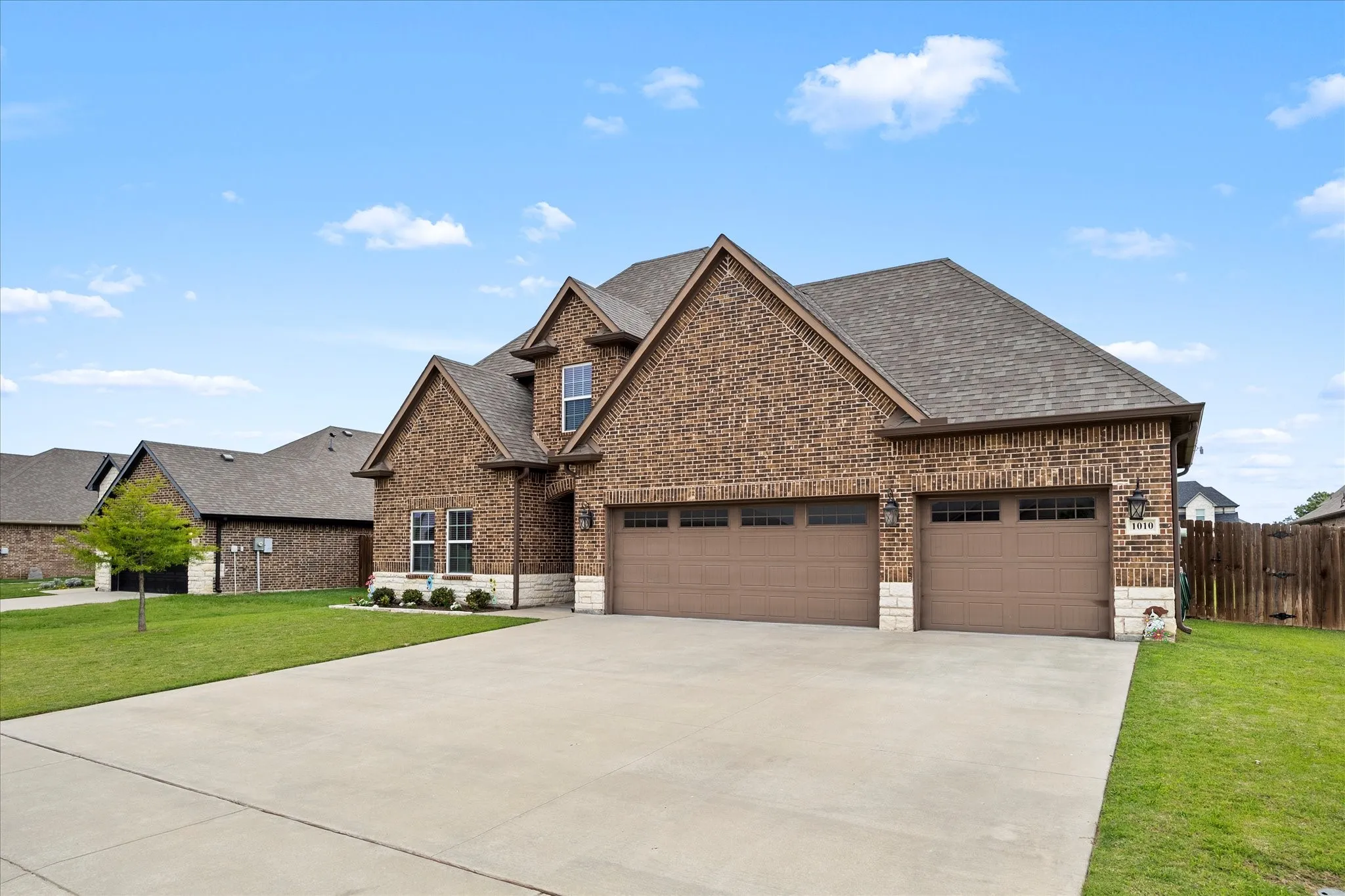 Extended drive and 3 car garage provide ample parking for family and friends.