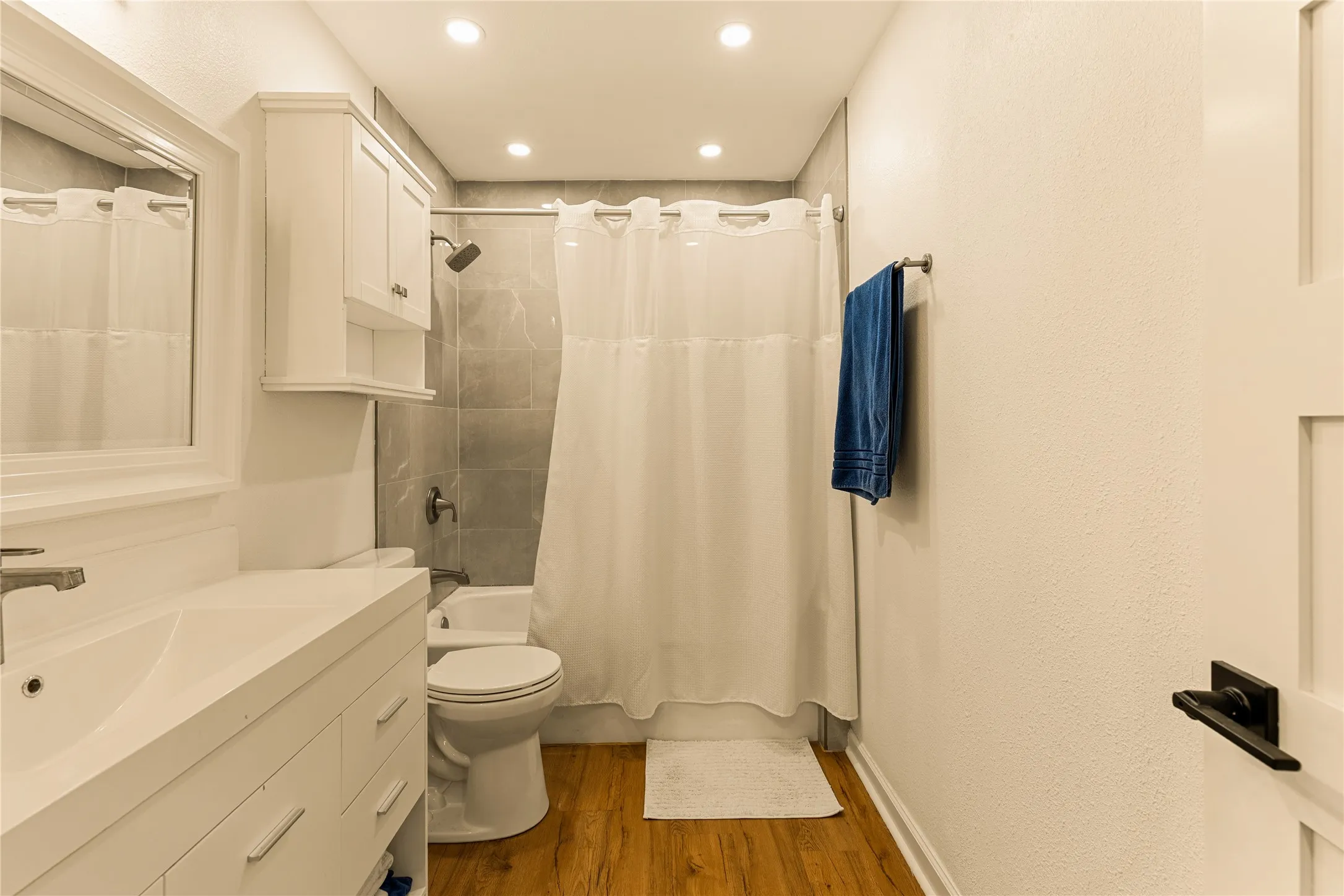 Updated vanity and intentional finishes throughout the bathroom.
