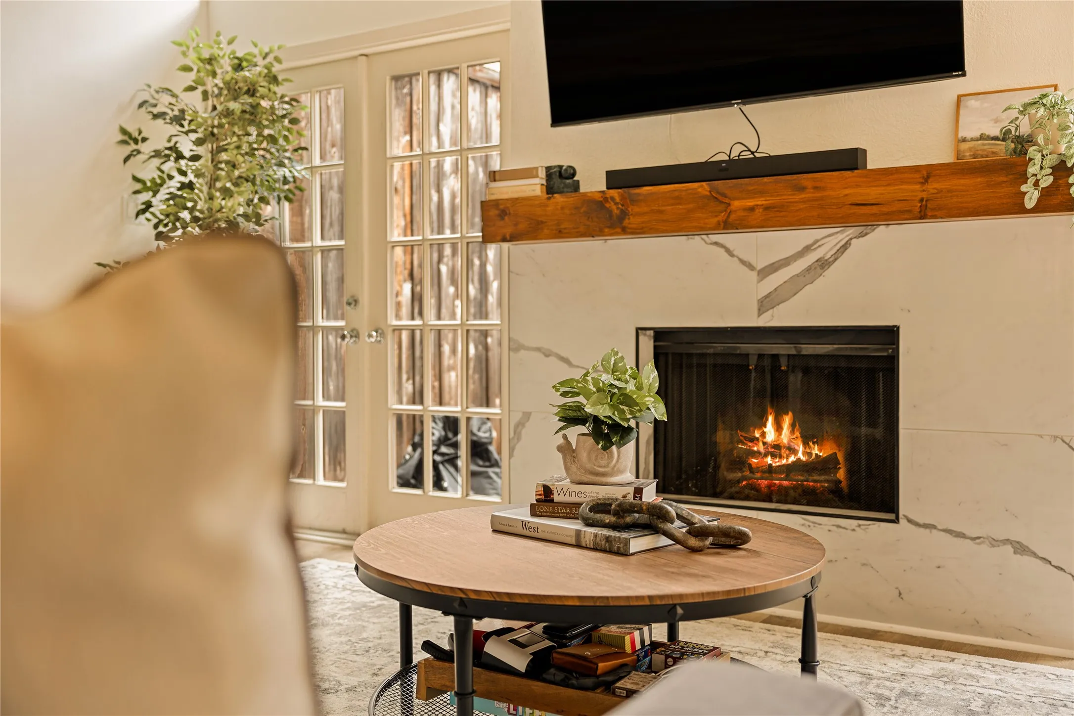 Bright and inviting living room with tall ceilings and warm finishes.