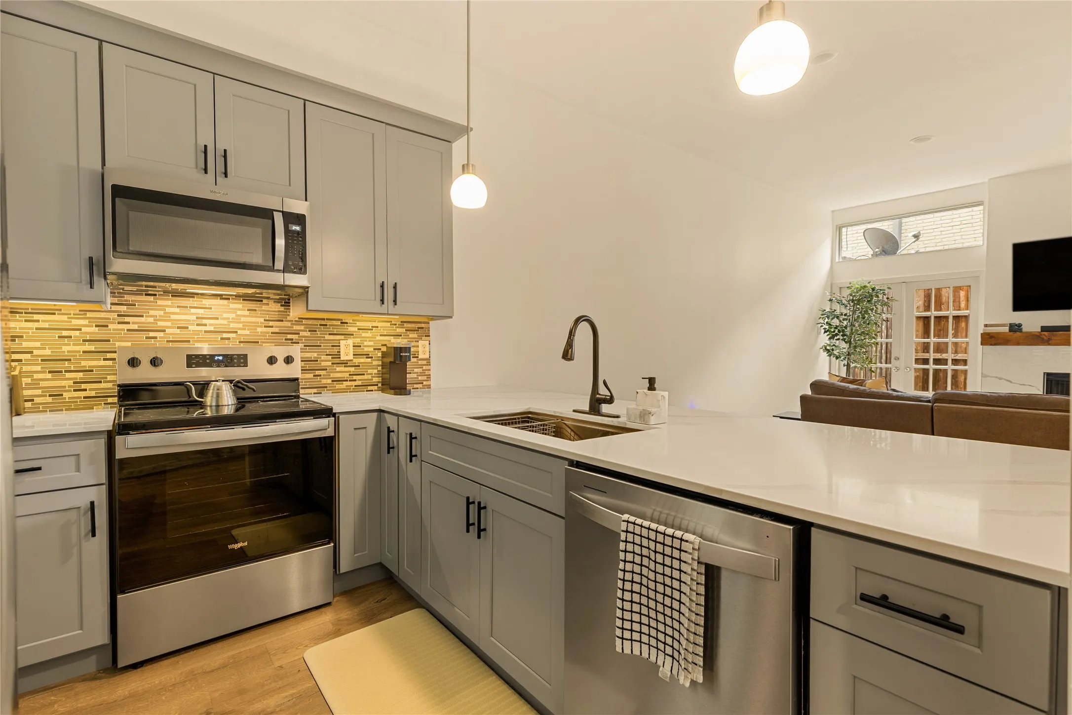 New appliances complement the modern kitchen renovation.