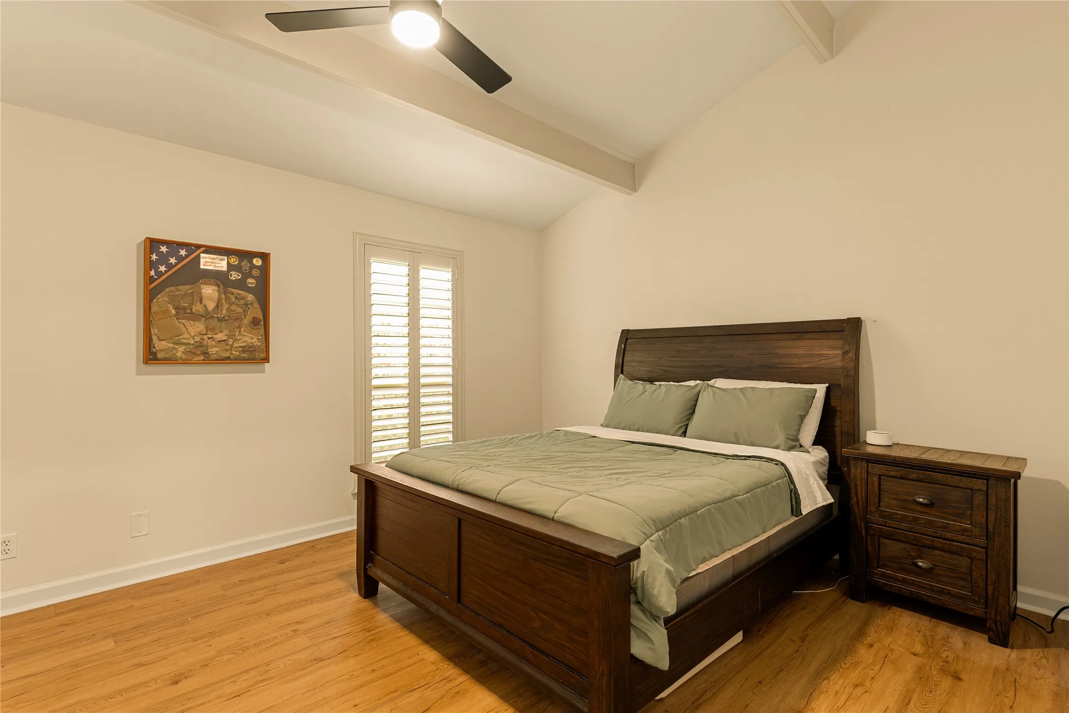 Light filled primary bedroom with a calm, inviting feel.