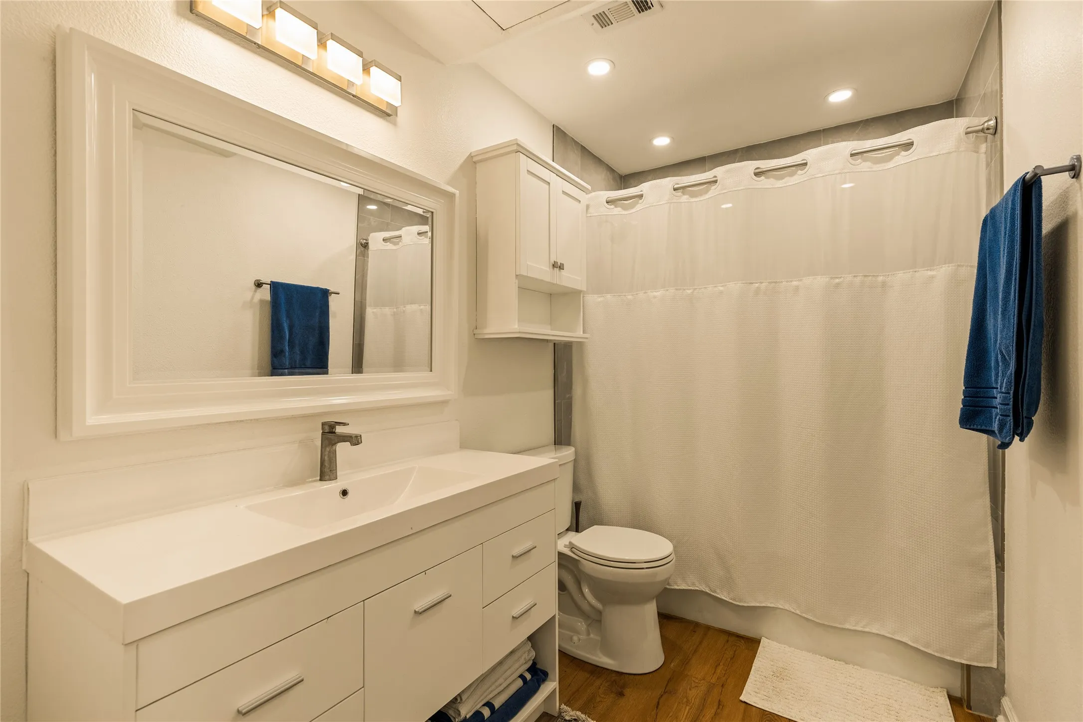 Renovated bathroom with clean, modern design details.
