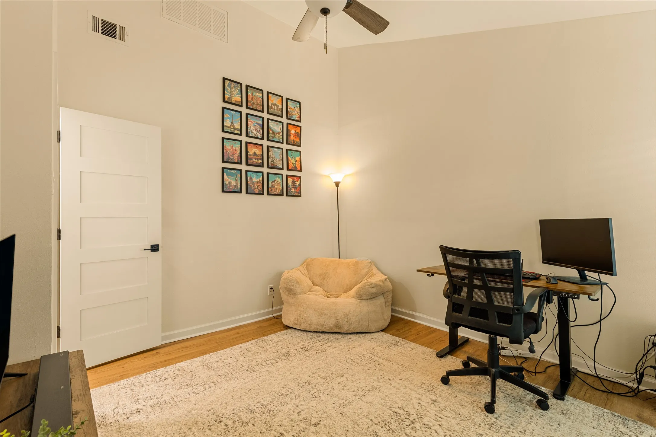 Spacious secondary bedroom with flexibility for guests or office space.