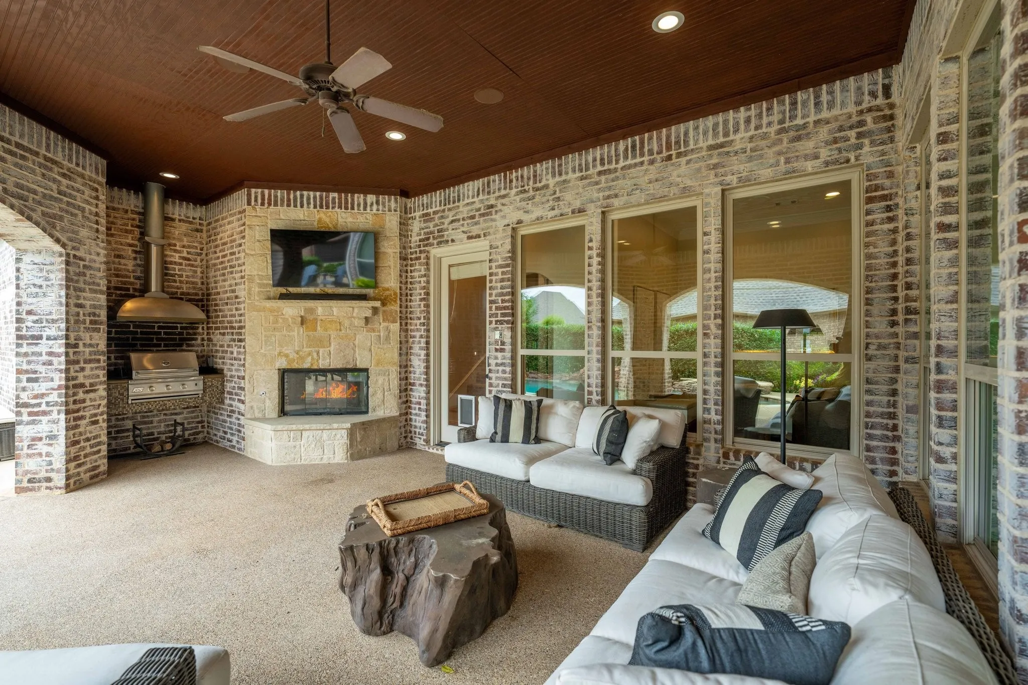 Covered patio with outdoor grill and fireplace