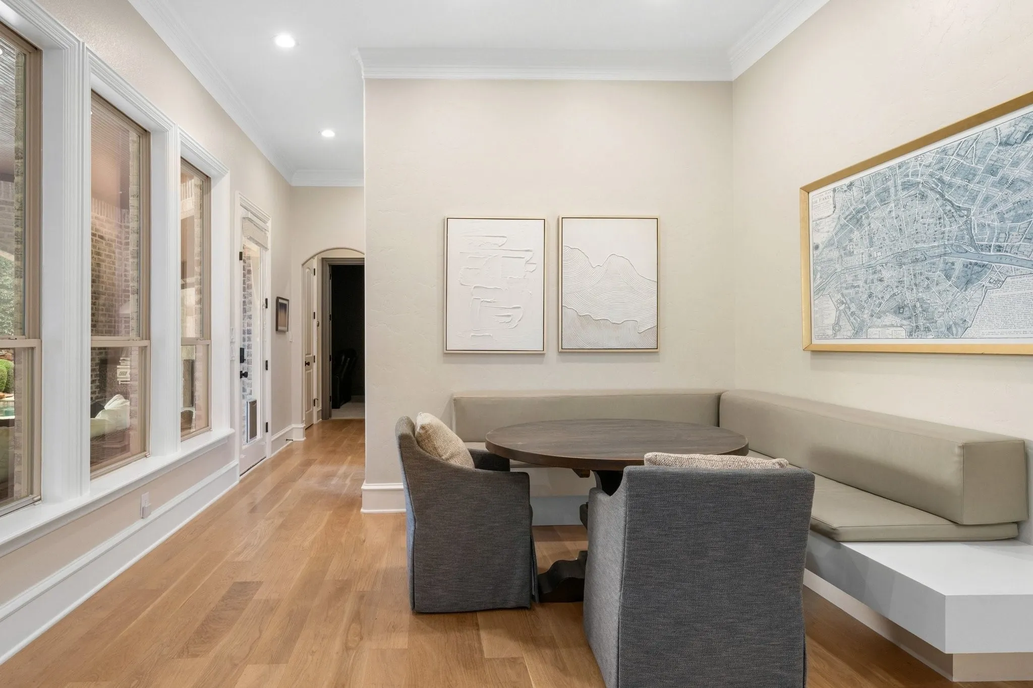 Built-in corner bench seating with a round table