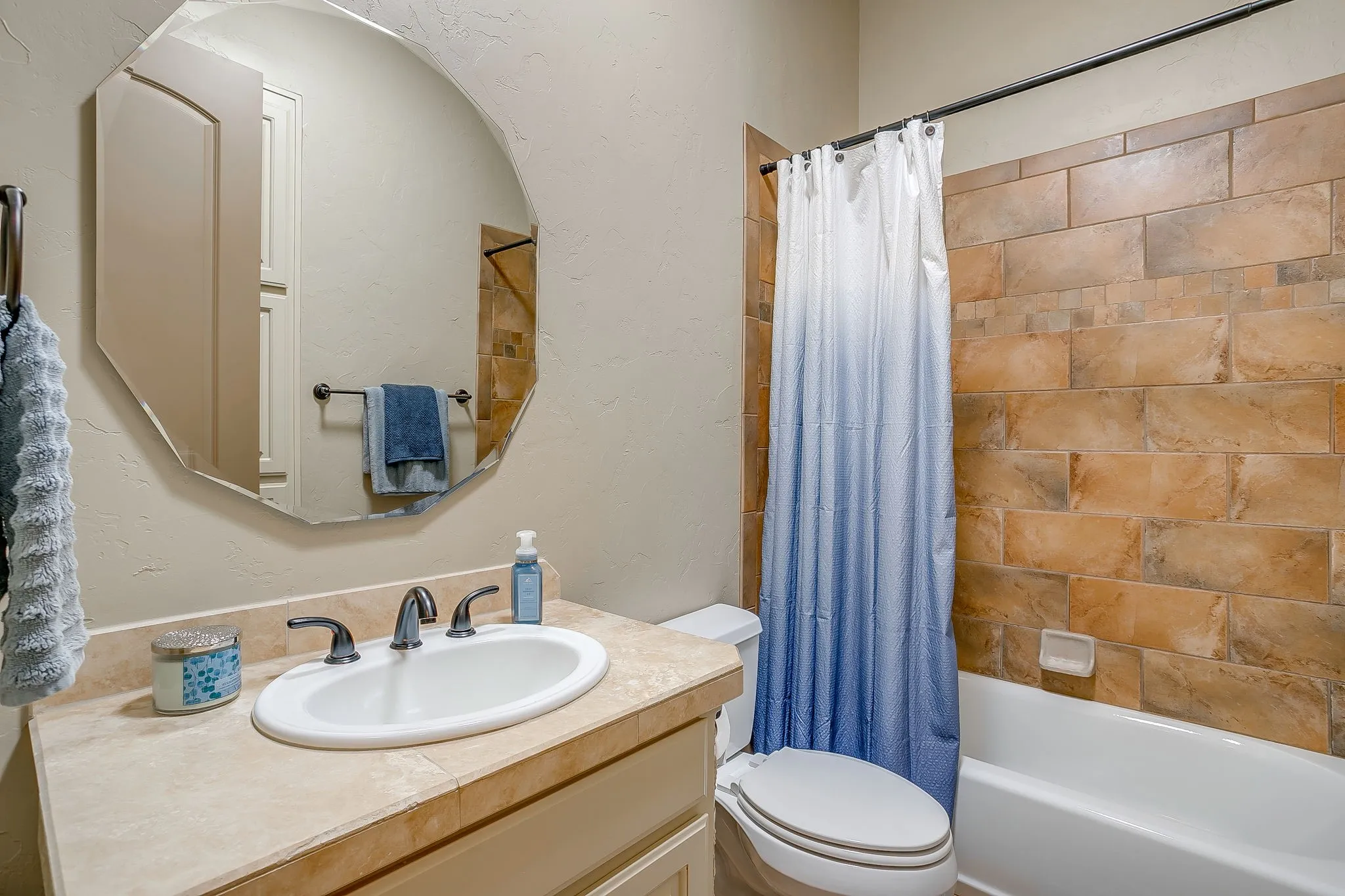 Bathroom #2 by second bedroom featuring a vanity with an oval sink, dark bronze-finish faucet, and light-toned countertop
