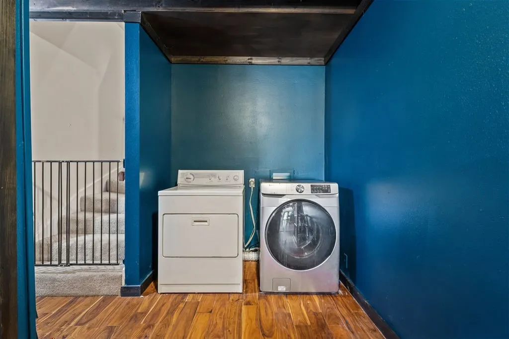 Laundry room with stairs leading to 1 bedroom and bonus room upstairs