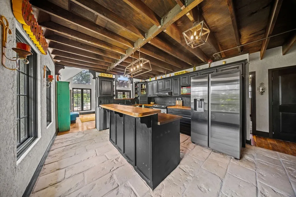 Stone flooring, butcher block counters and exposed beamed ceilings add lots of charm and architectural​​‌​​​​‌​​‌‌​‌‌​​​‌‌​‌​‌​‌​​​‌​​ interest