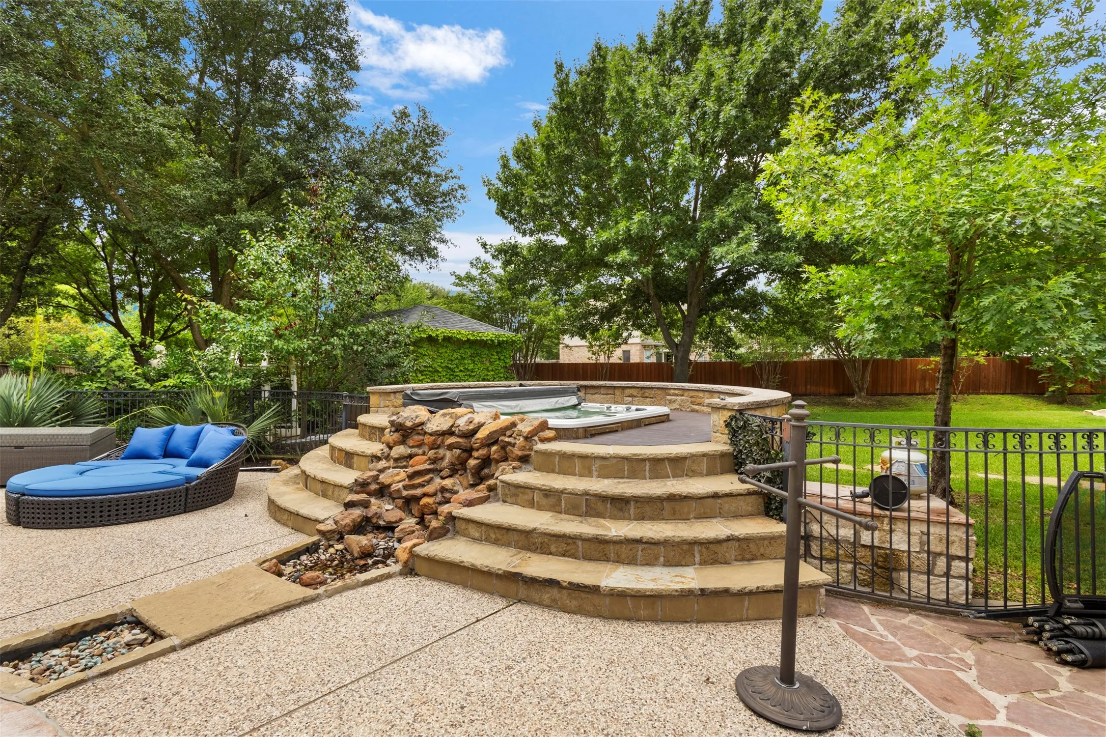 Hot tub with waterfall feature