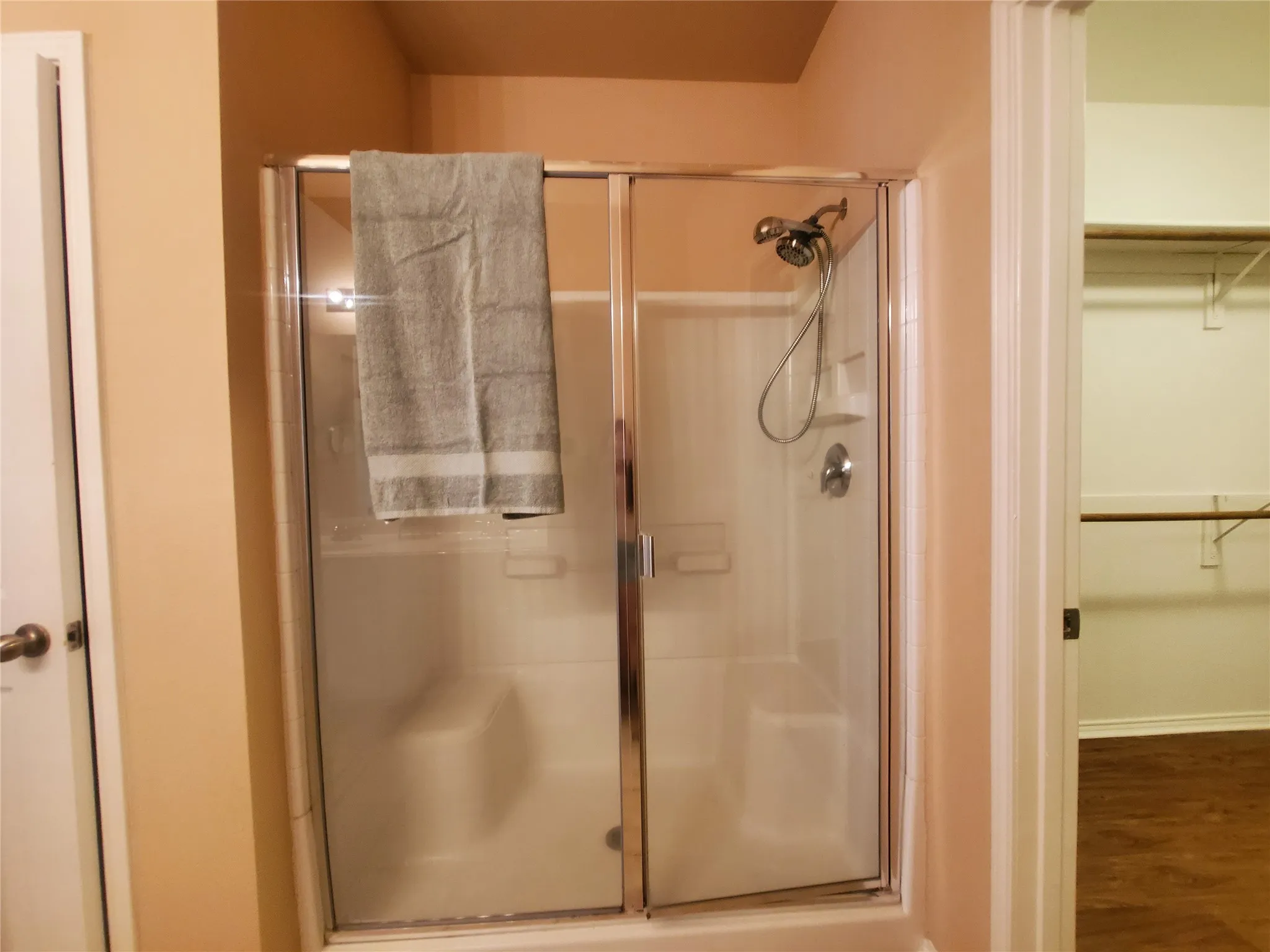 Bathroom with a shower with door