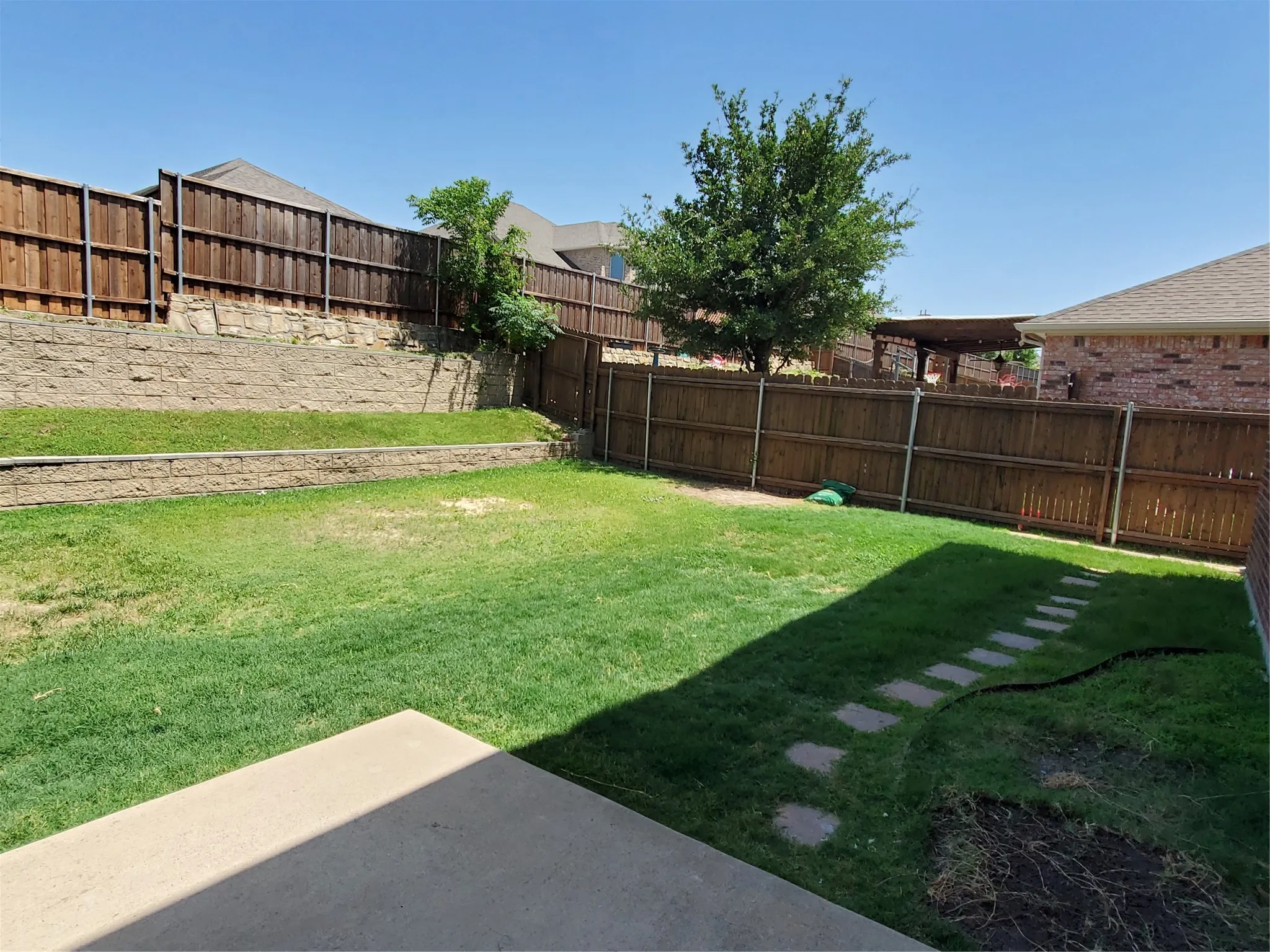 View of back yard with patio