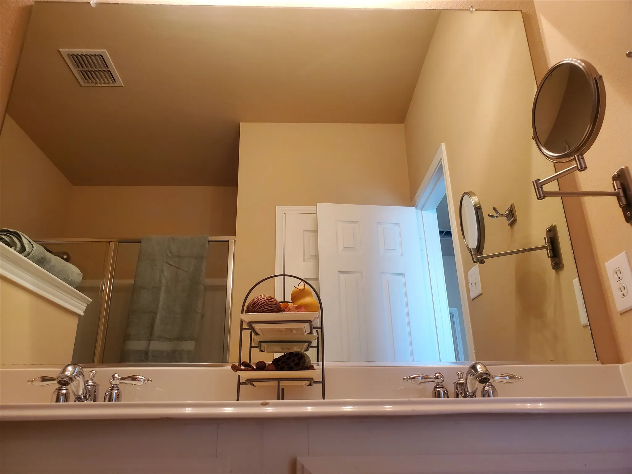 View of bathroom with dual sinks.