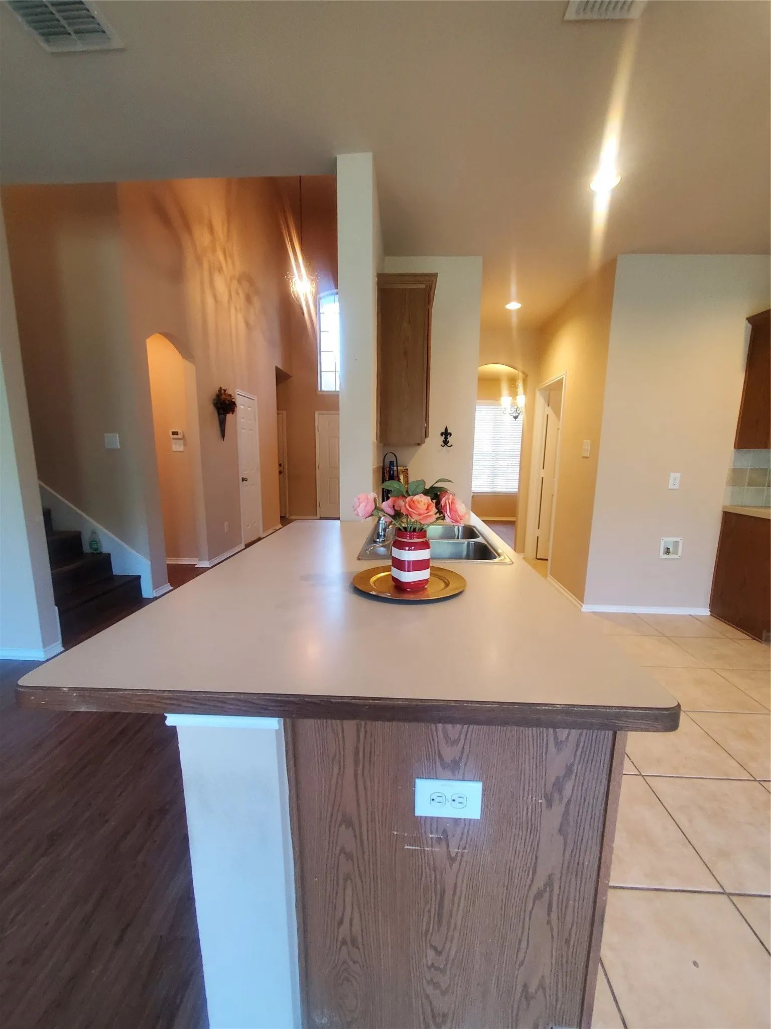 Kitchen featuring sink and ample counter space, open to living room
