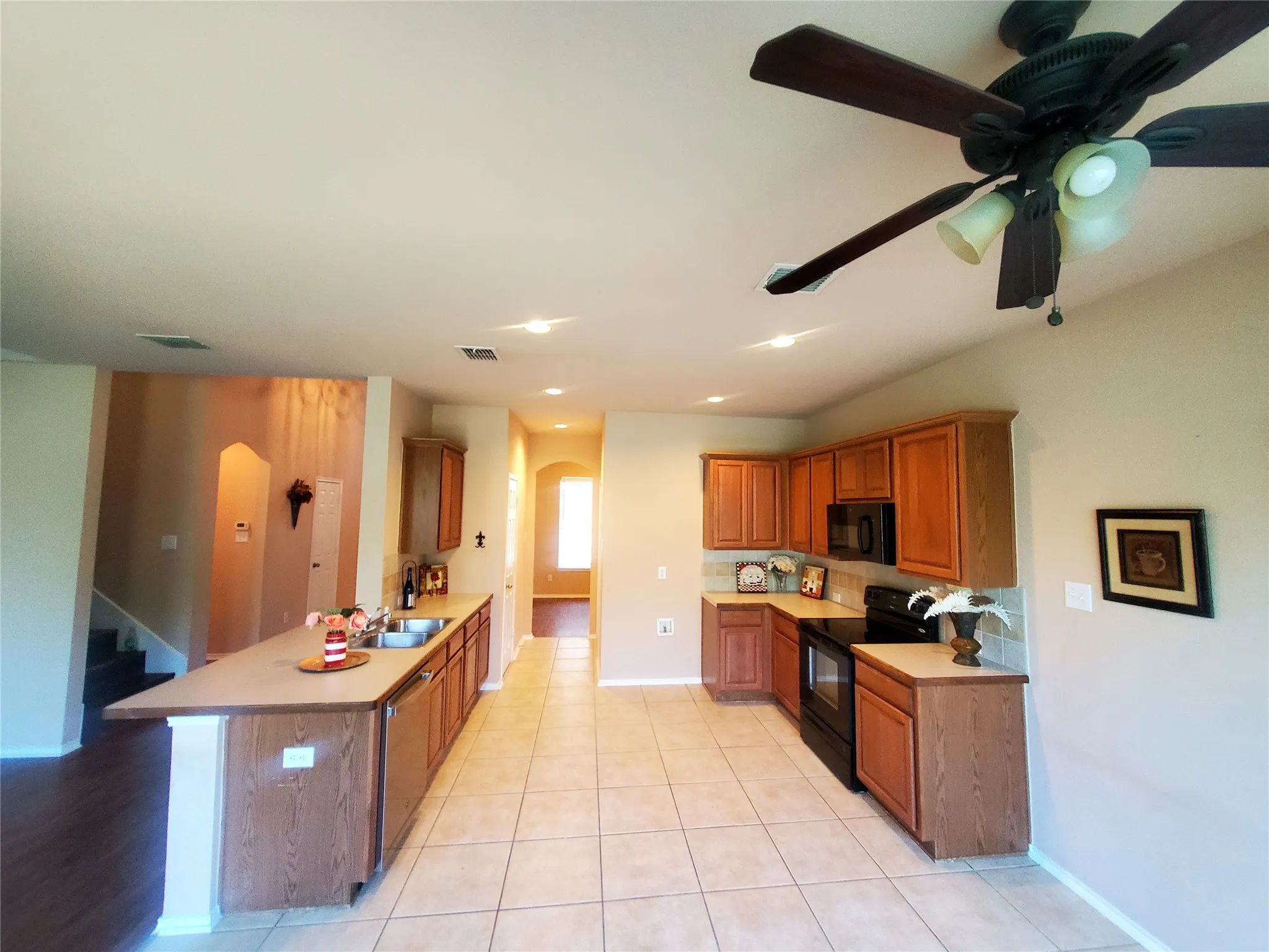 Breakfast area with ceiling fan open to the kitchen and with ceramic tile