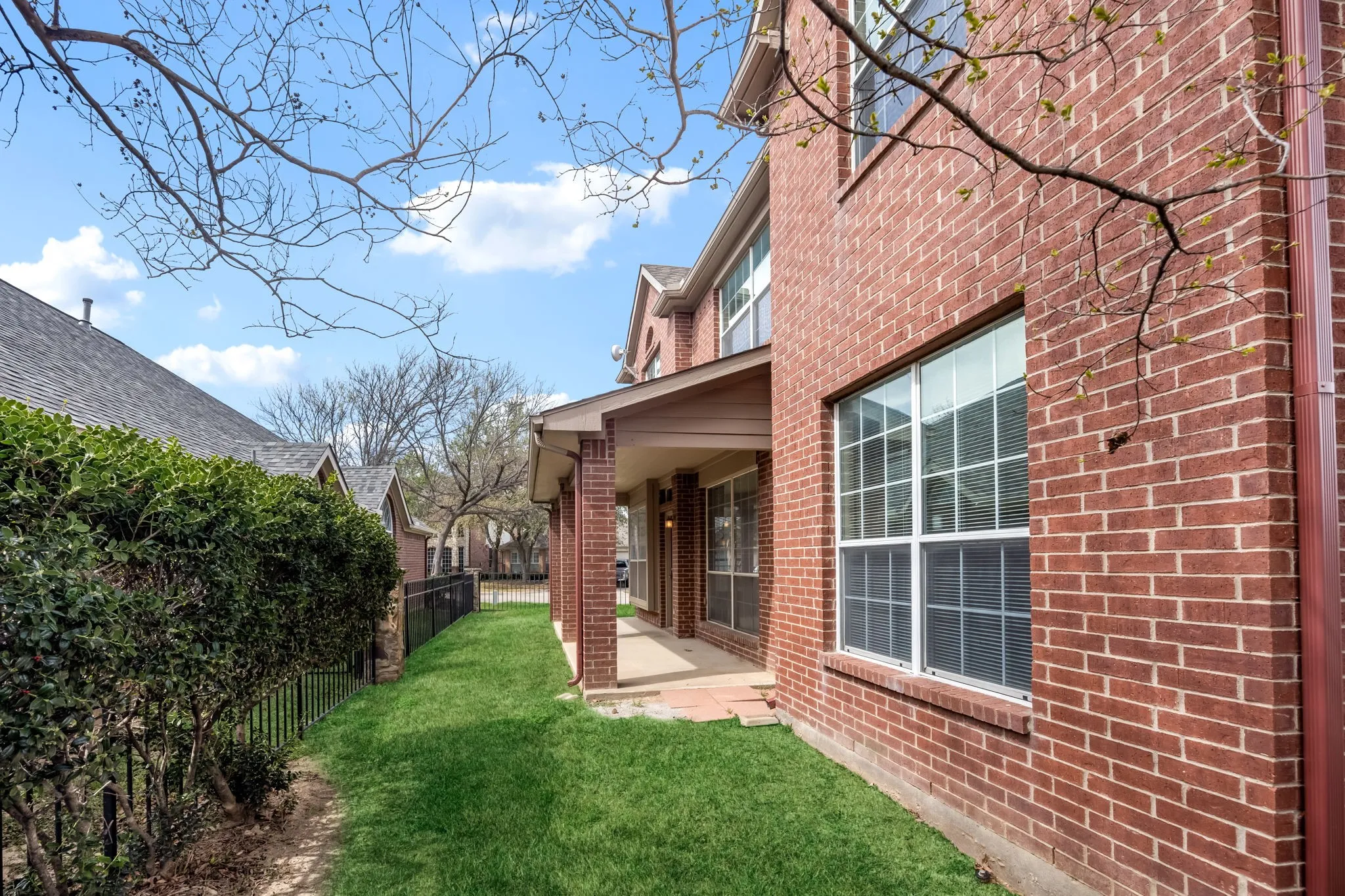 Fenced backyard with covered porch