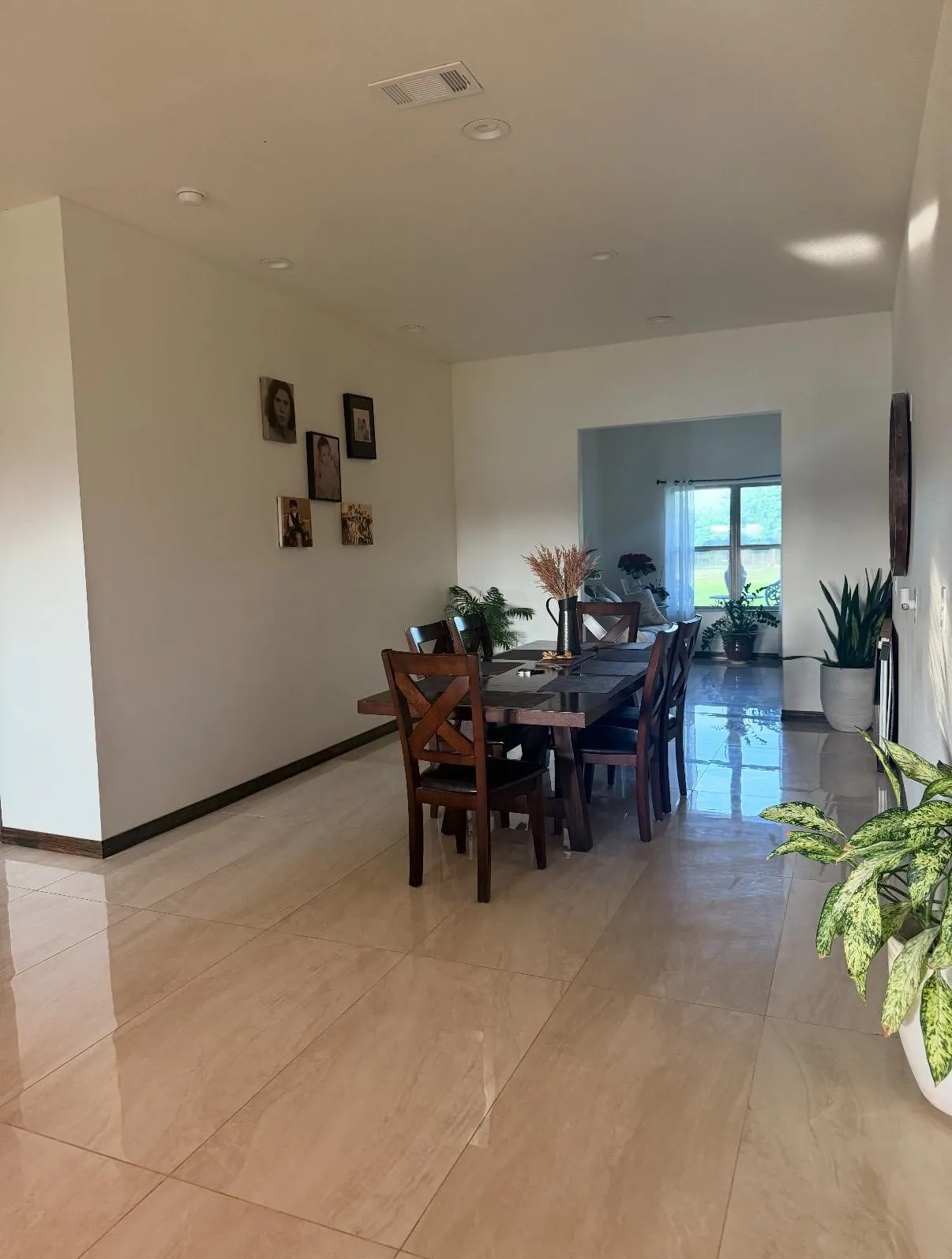 Spacious room featuring neutral tone tile flooring and recessed ceiling lighting
