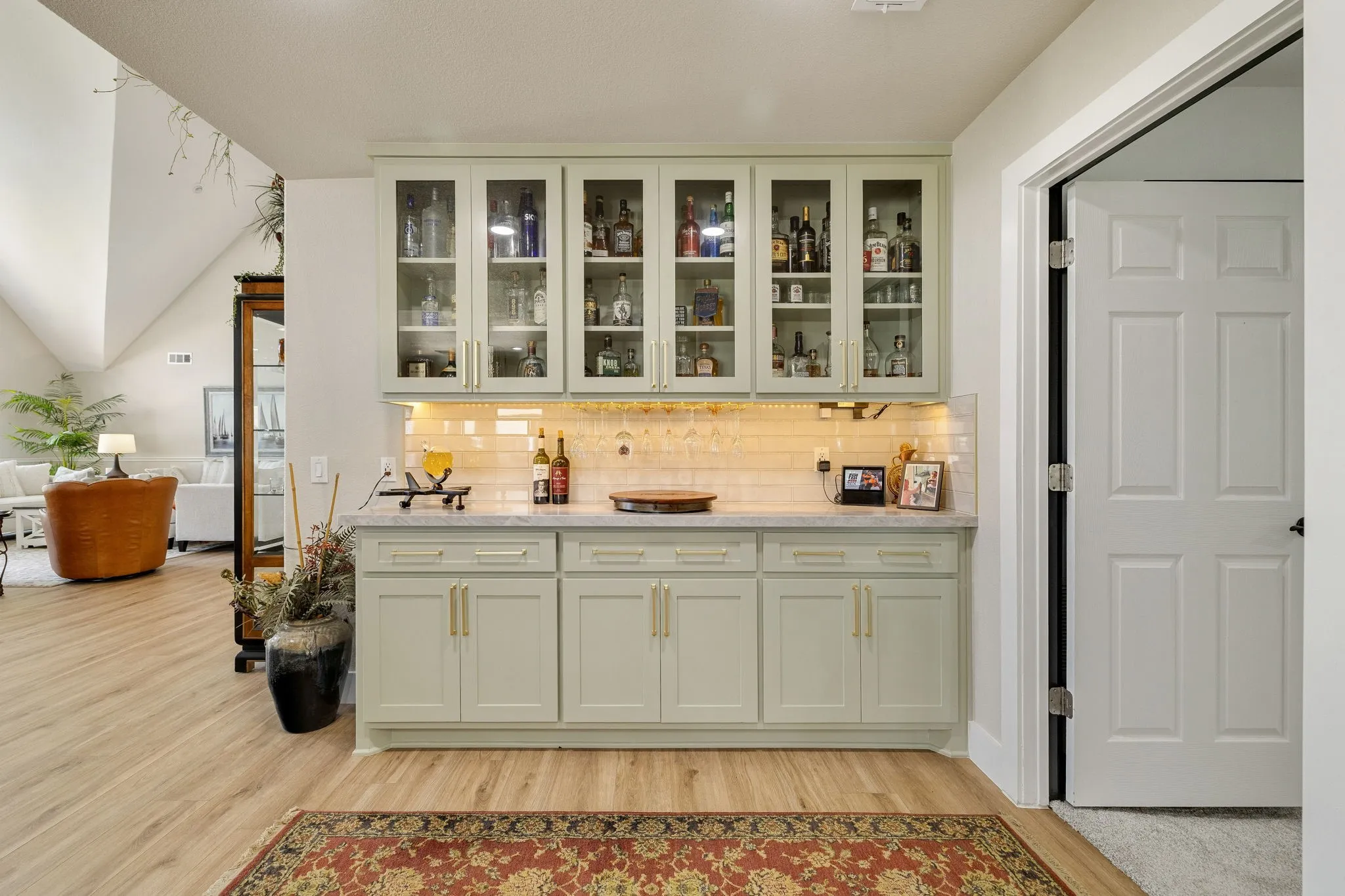 Built-in cabinetry featuring glass-front upper cabinets, solid lower cabinets, and a light-toned countertop