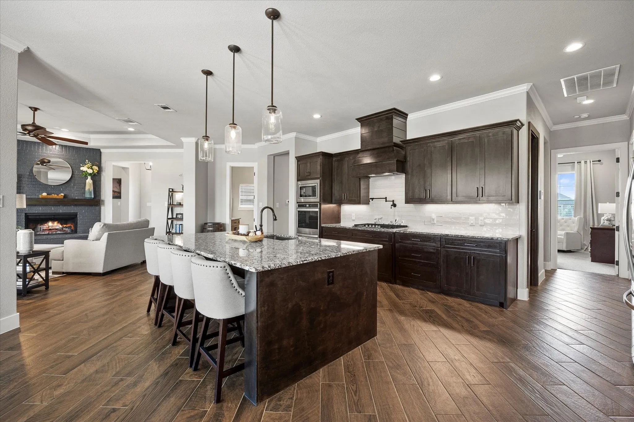 Open floor plan features dream kitchen opening onto family room