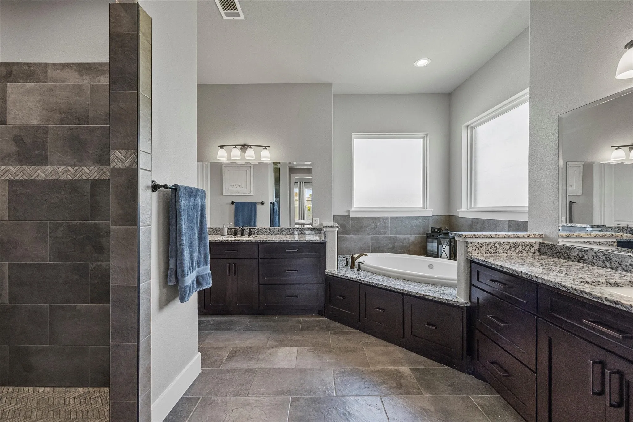 Relax and refresh in this spa style master bath