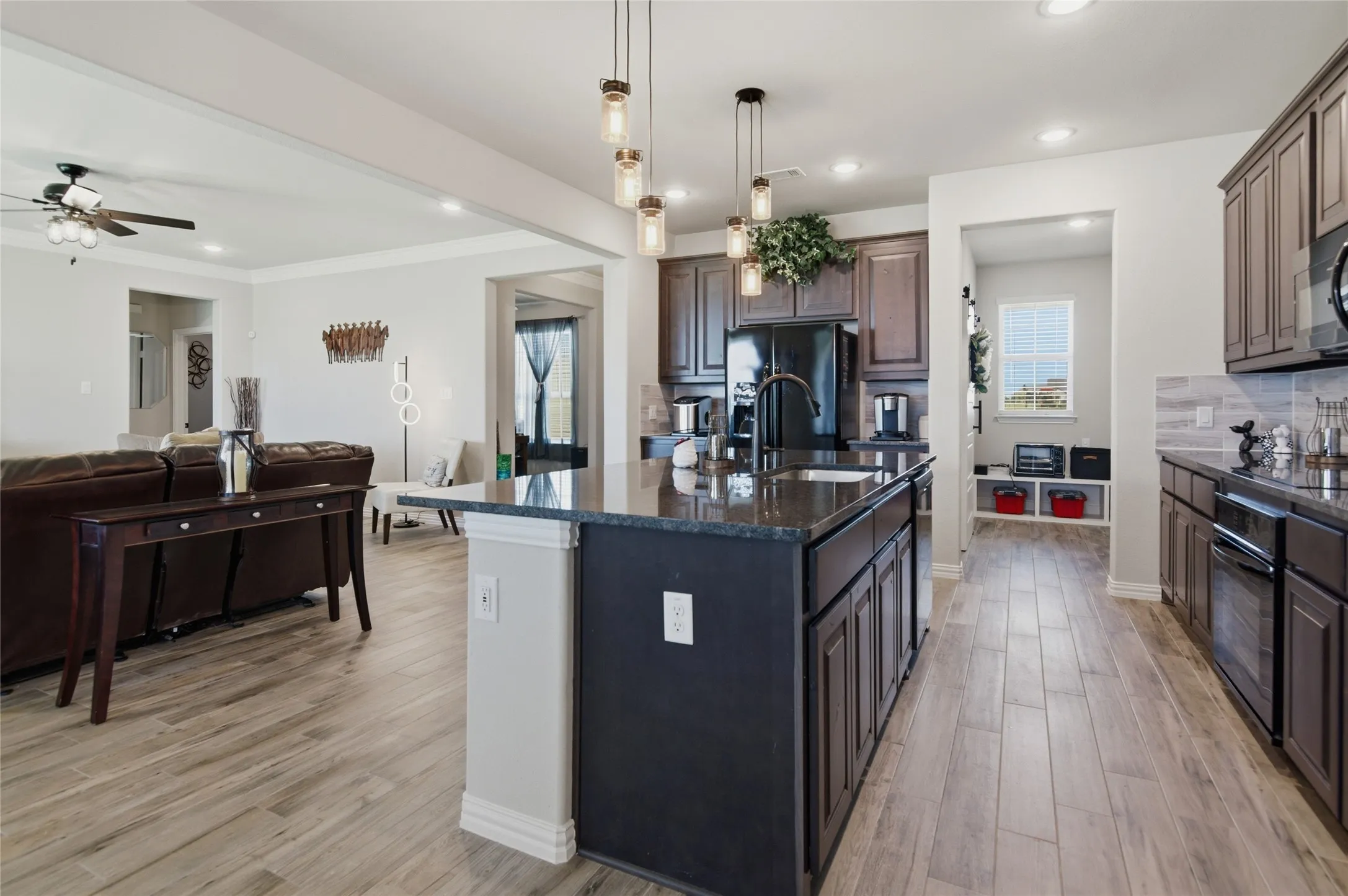 to the right is mudroom with door to laundry room and door to garage. straight ahead is looking at flex room and to the left is the secondary bedrooms.