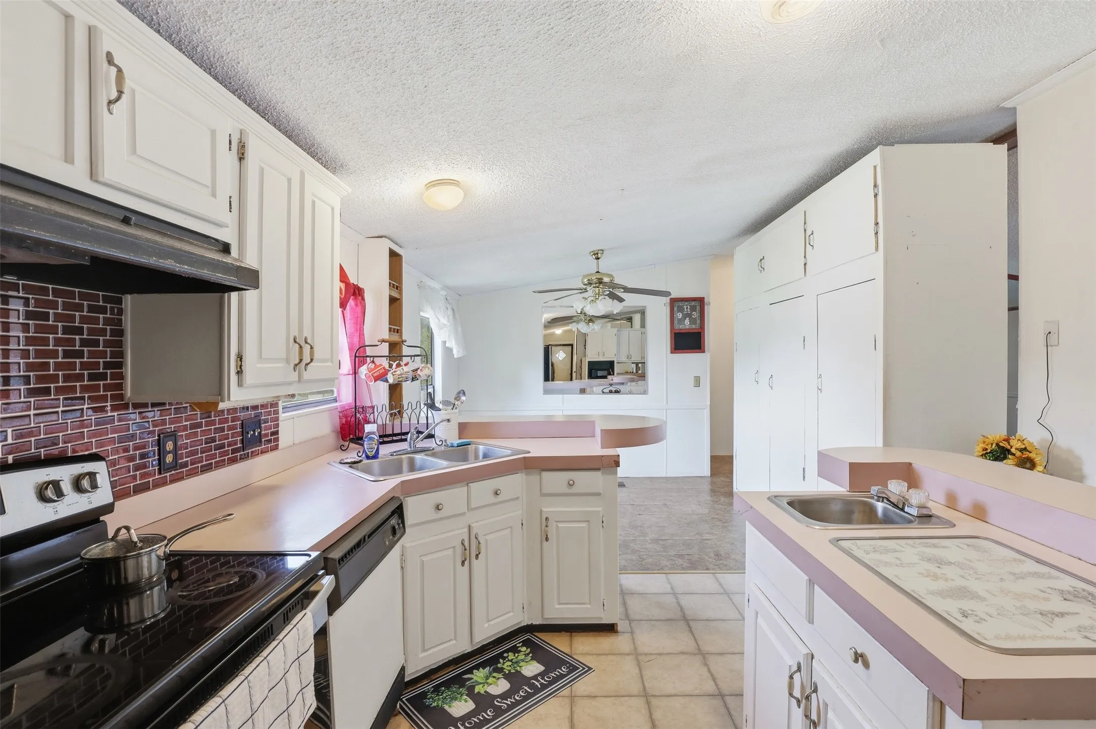 Another view of the kitchen. The large cabinet is removable and can open up more space.