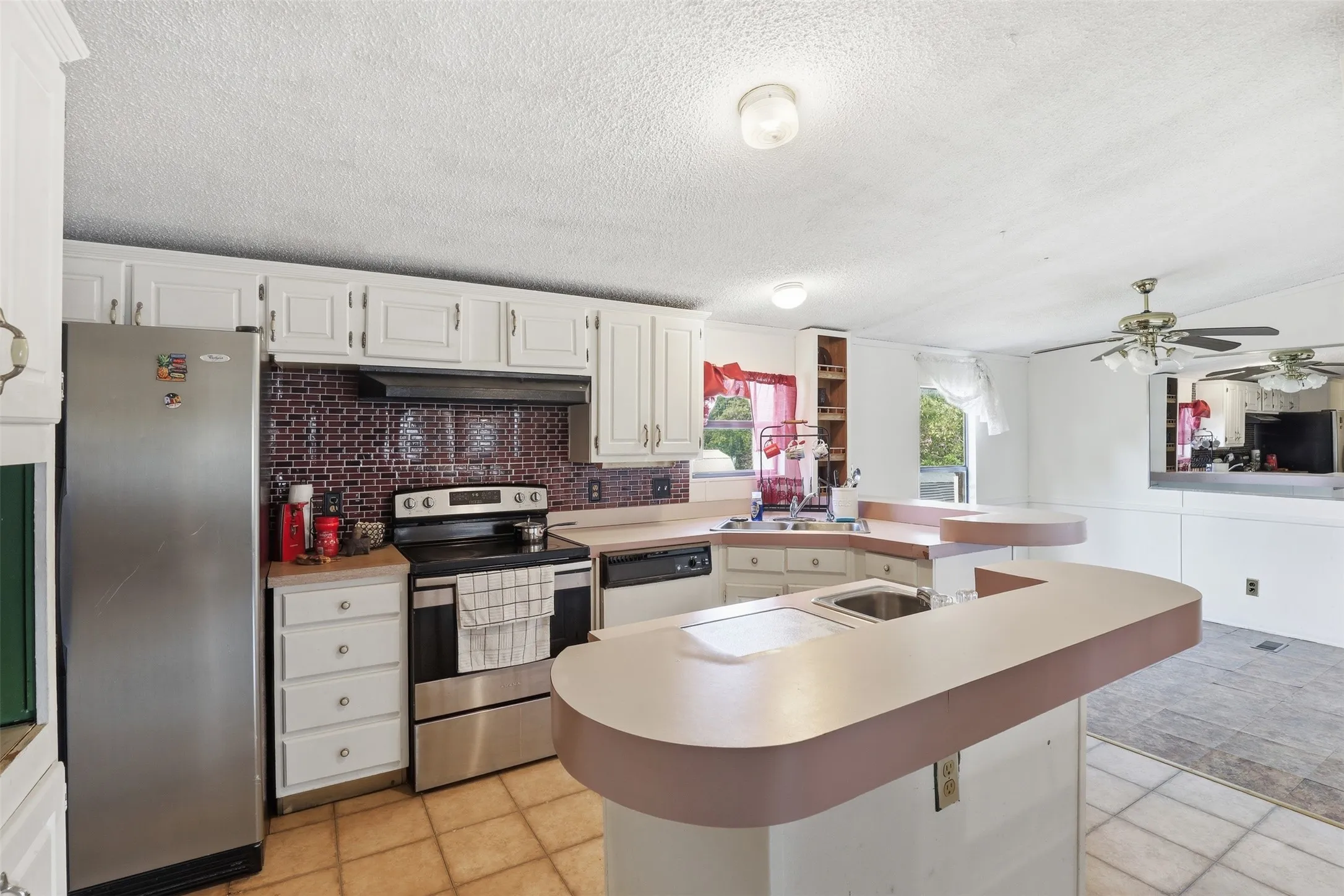 Large kitchen. Part of the mirrored wall extends to the kitchen. Eat in kitchen.