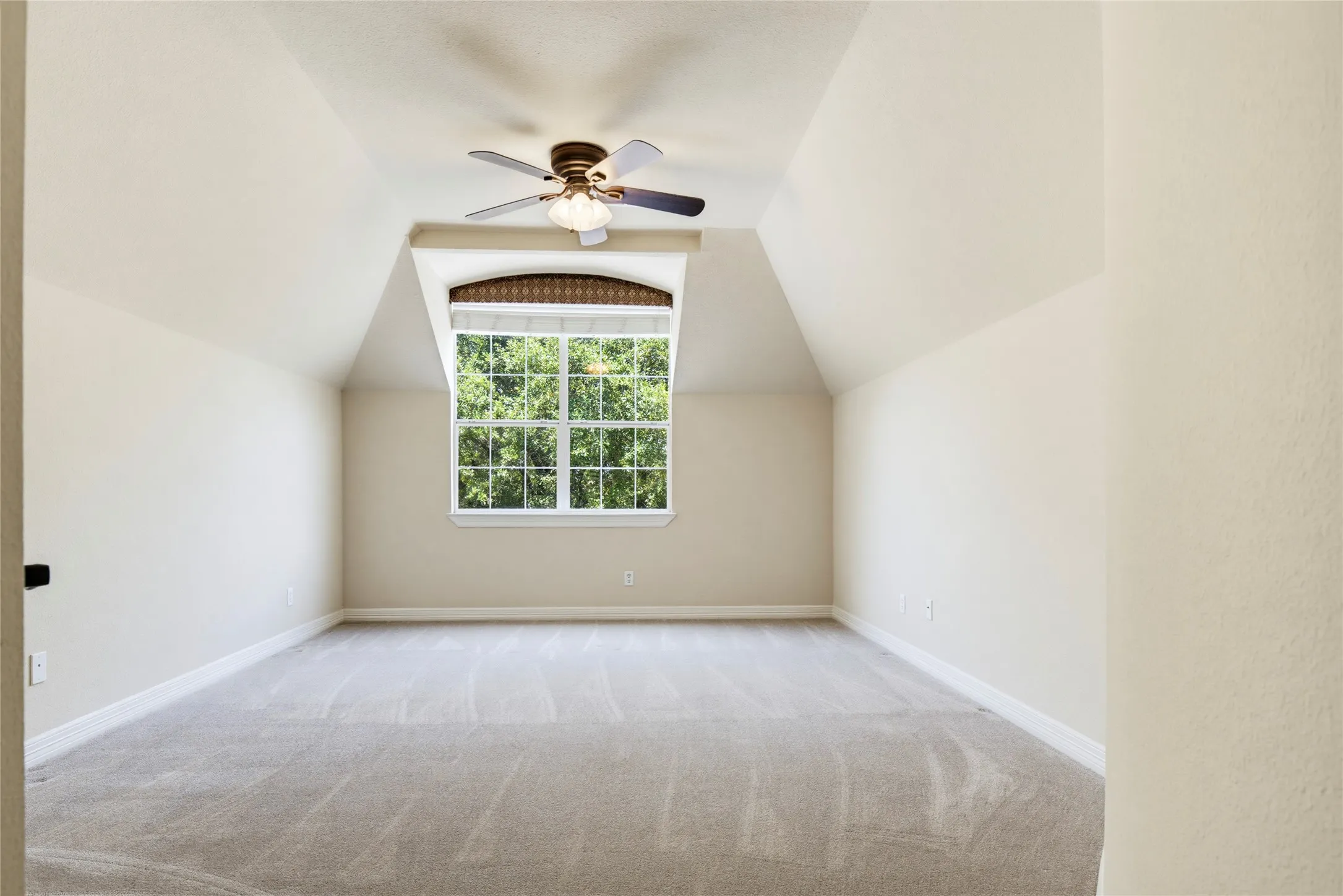 One of 3 upstairs bedrooms.  This one is located on a hallway off of the game room and measures 18' x 13'. A full bathroom is on the same hallway.
