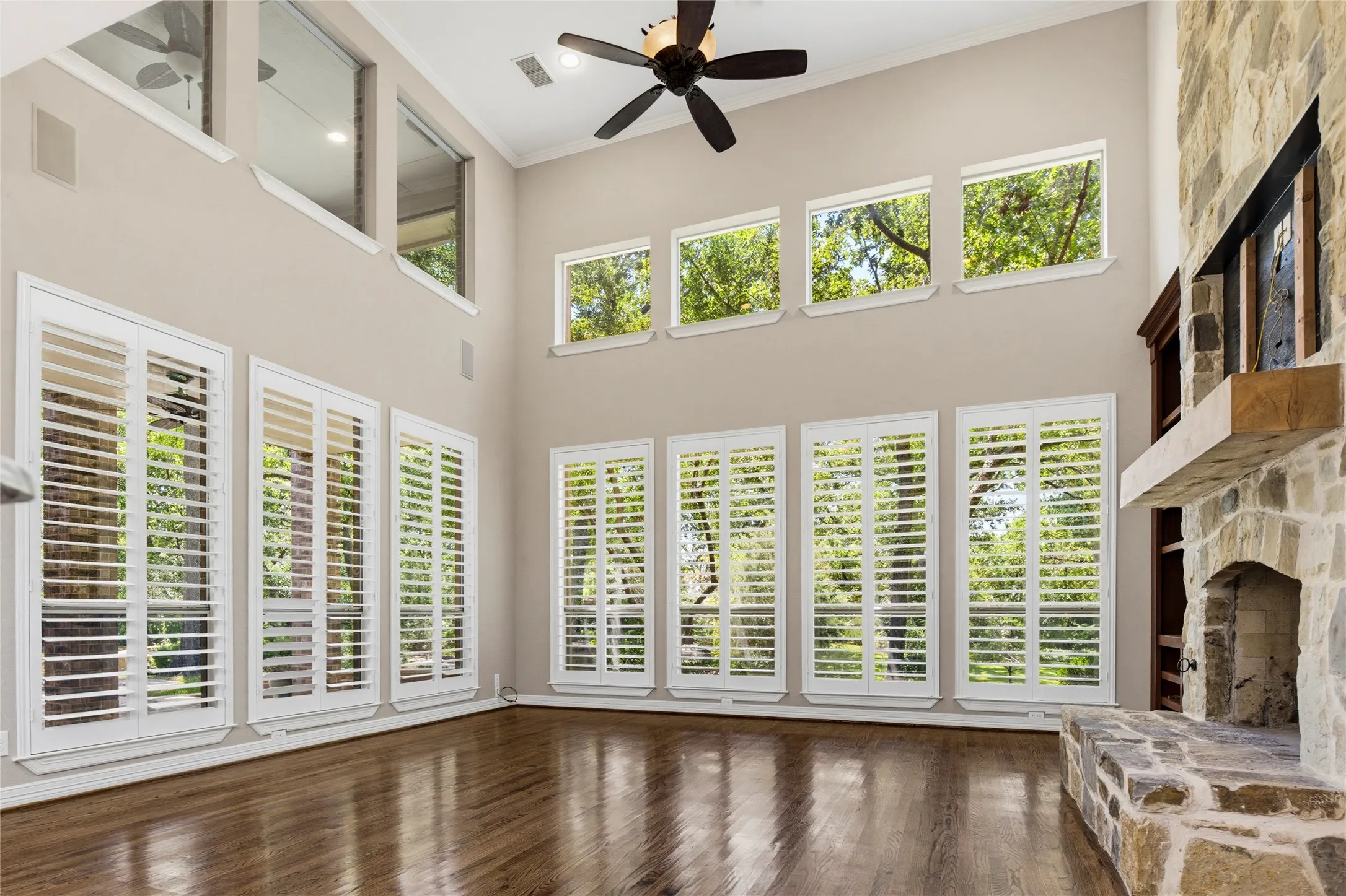 Plantation shutters with 3 inch louvers finish out the picture windows in the living room and provide an easy way to manage the lighting during the day while providing privacy at night.