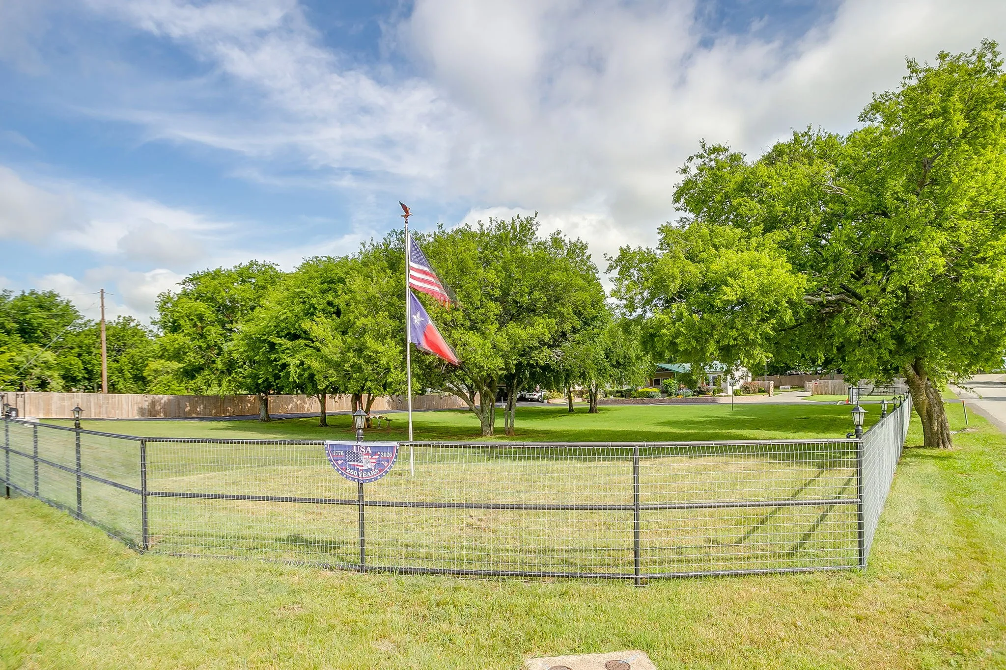 Large fenced corner lot