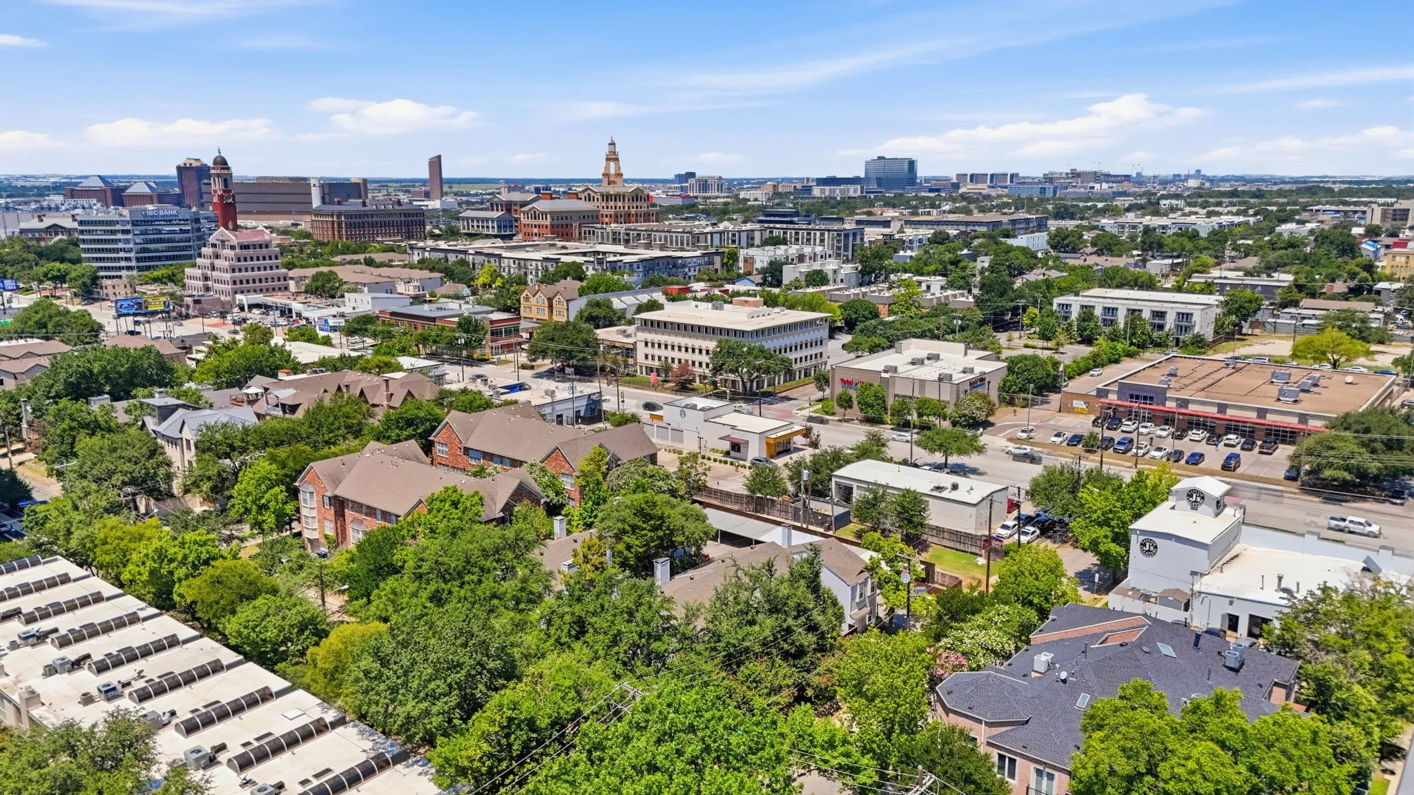 Expansive aerial perspective showcasing a vibrant urban landscape with diverse architectural styles