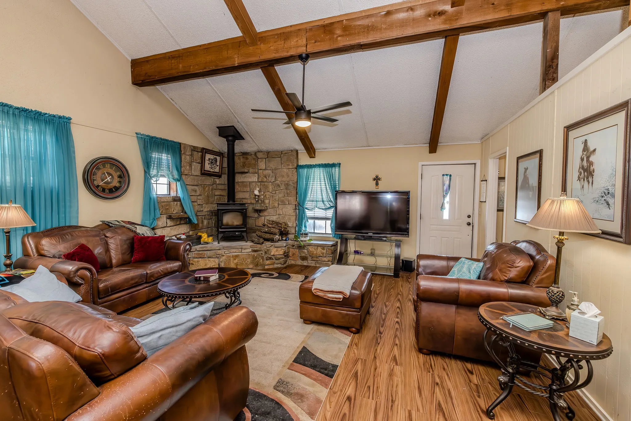 Living room viewed from dining area before furniture was removed.