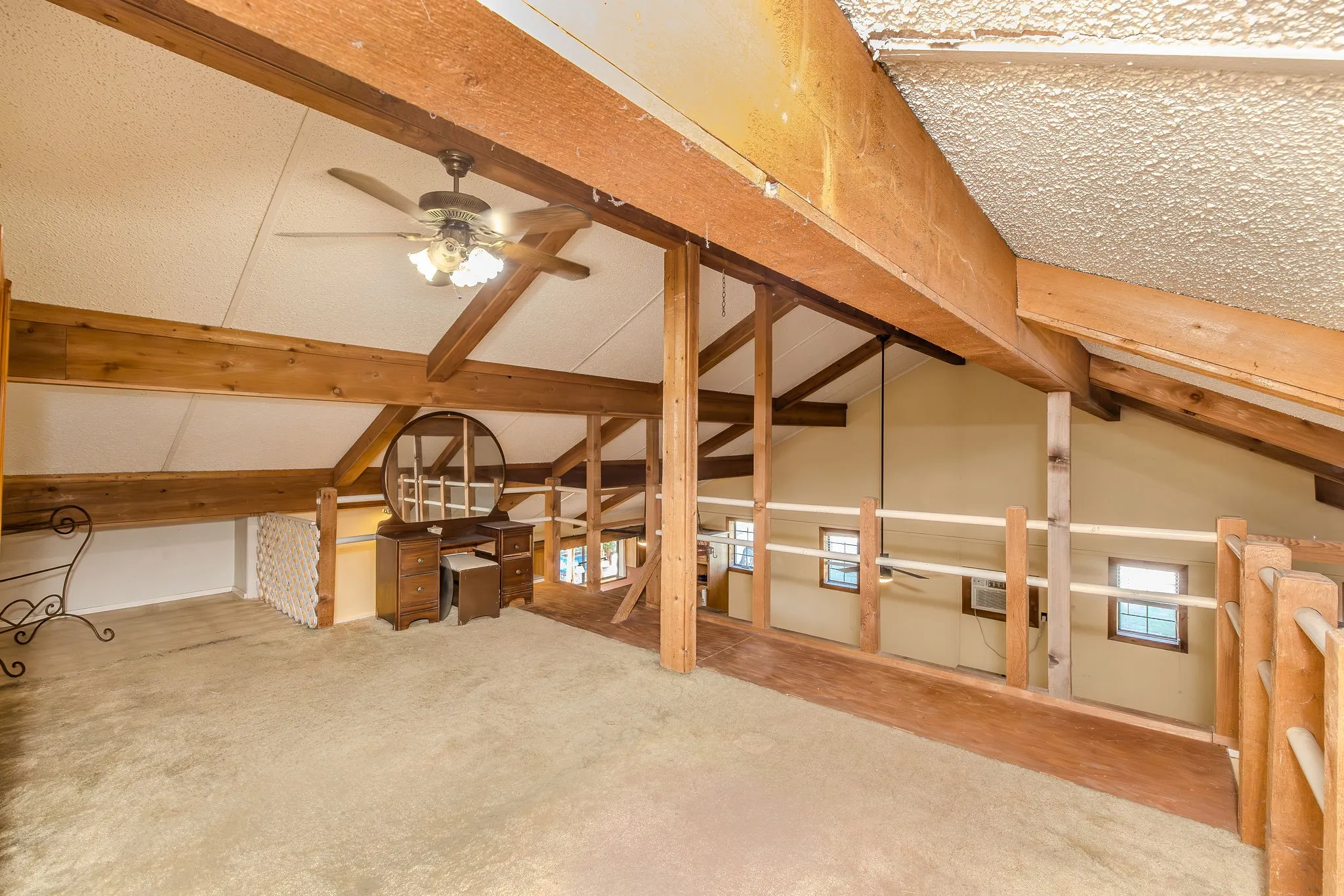 Owner used as a bedroom; the open loft is very large and looks out over the office and living - dining areas.