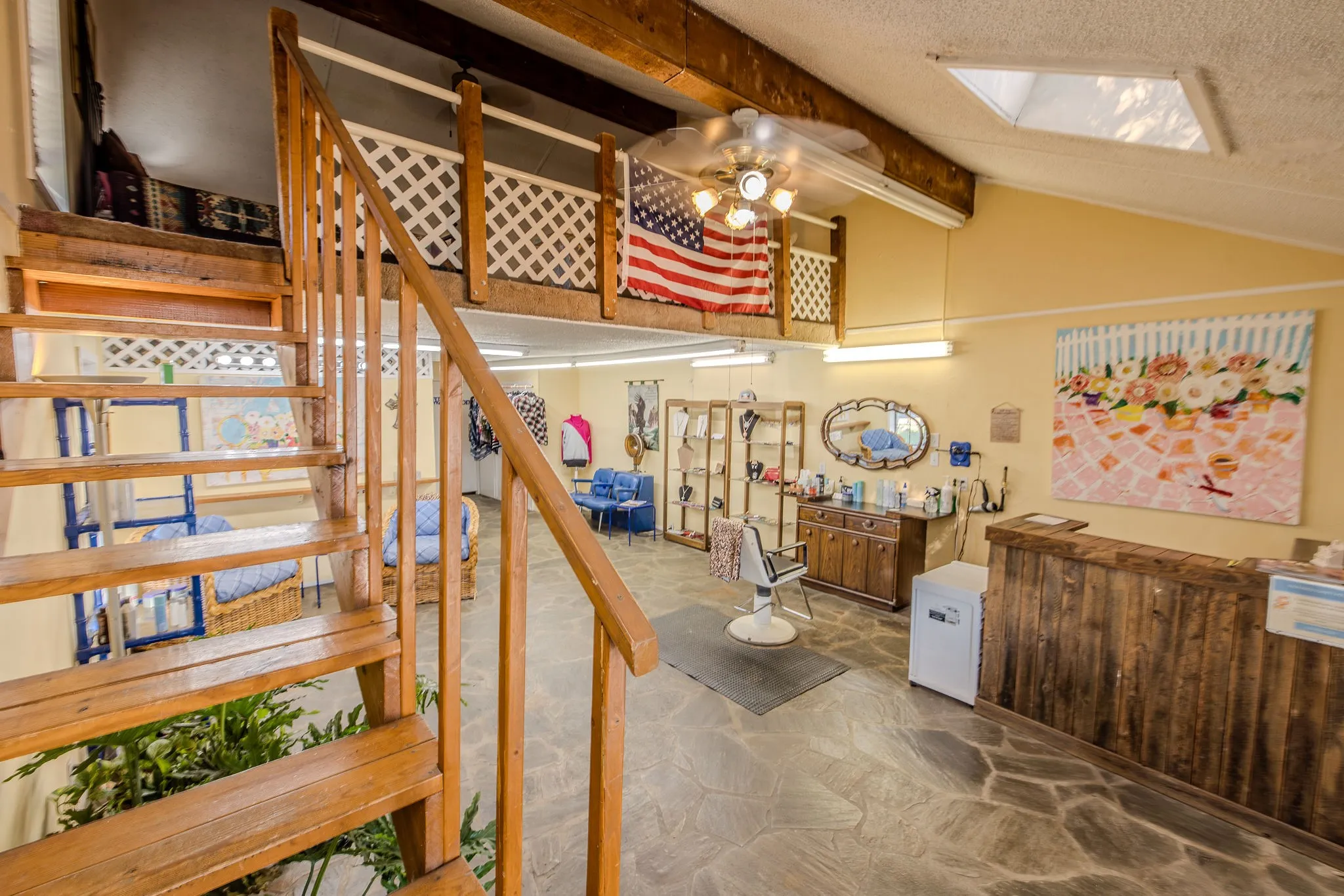 Stairway to loft, main salon, cashiers counter