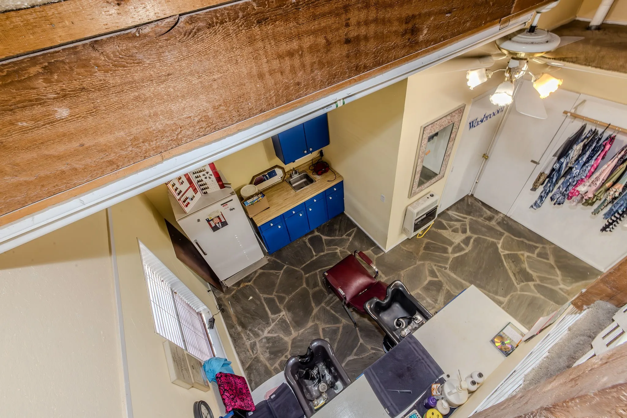 View from loft into the wash area of the salon, which could be converted to a kitchen if preferred.