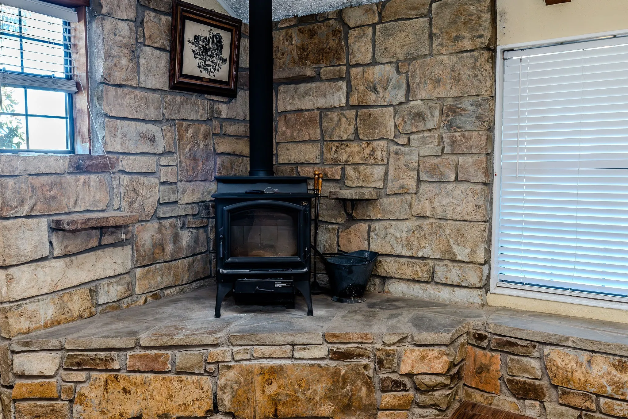 Check out the custom stone hearth and surrounding walls for the wood-burning stove!