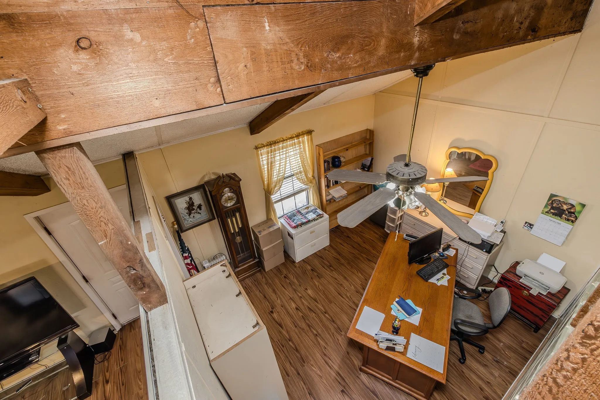 View of office (or bedroom) from loft. This room was built with the open ceiling to allow airflow for more efficient cooling and heating, but could possibly be enclosed.