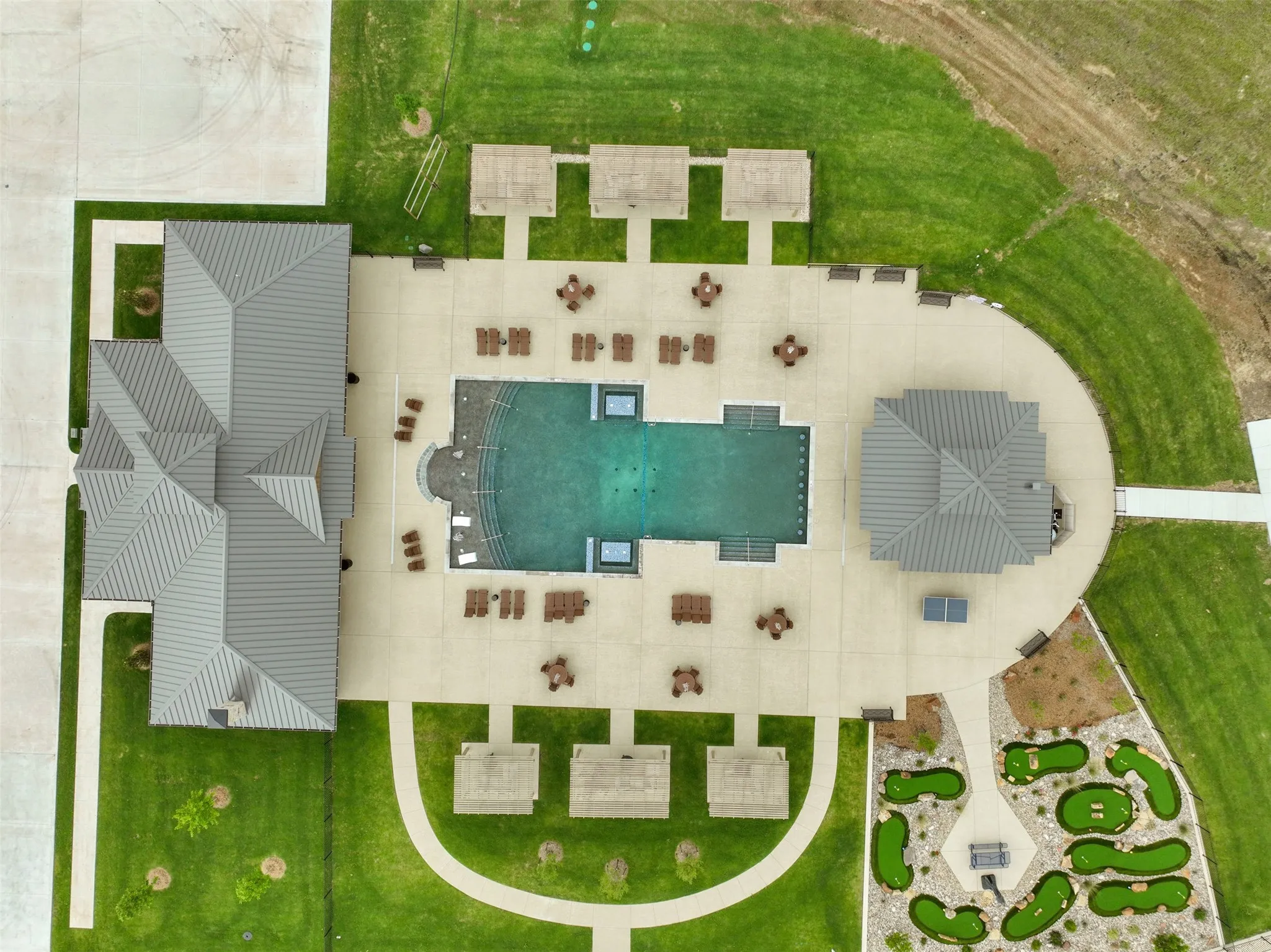 Aerial of clubhouse, pool and miniature golf