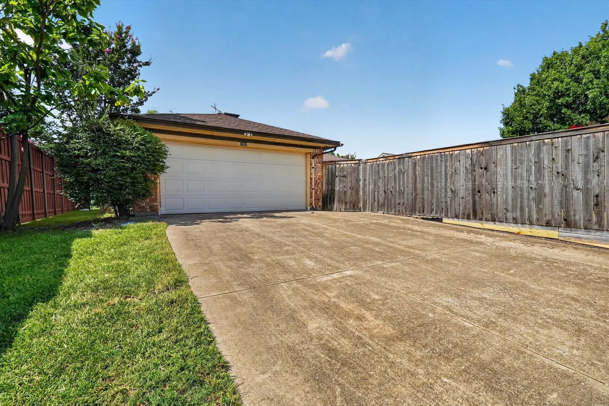 Long driveway to the garage.  Wanna play some basketball?