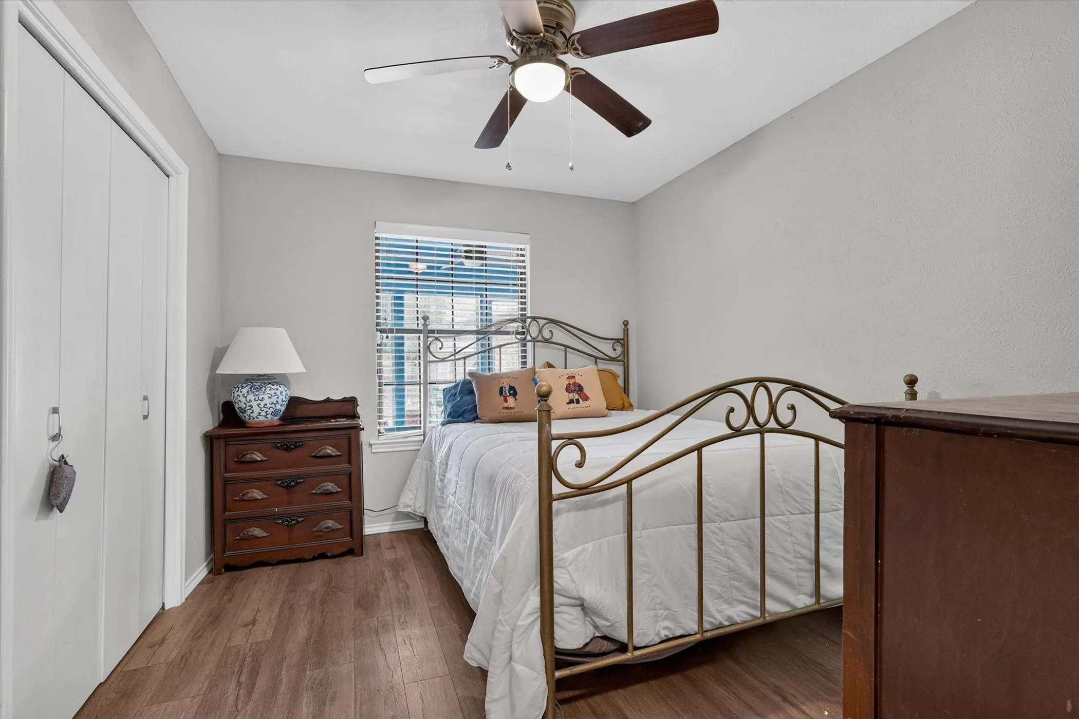 Bedroom #2 with lovely wood-like flooring and ceiling fan