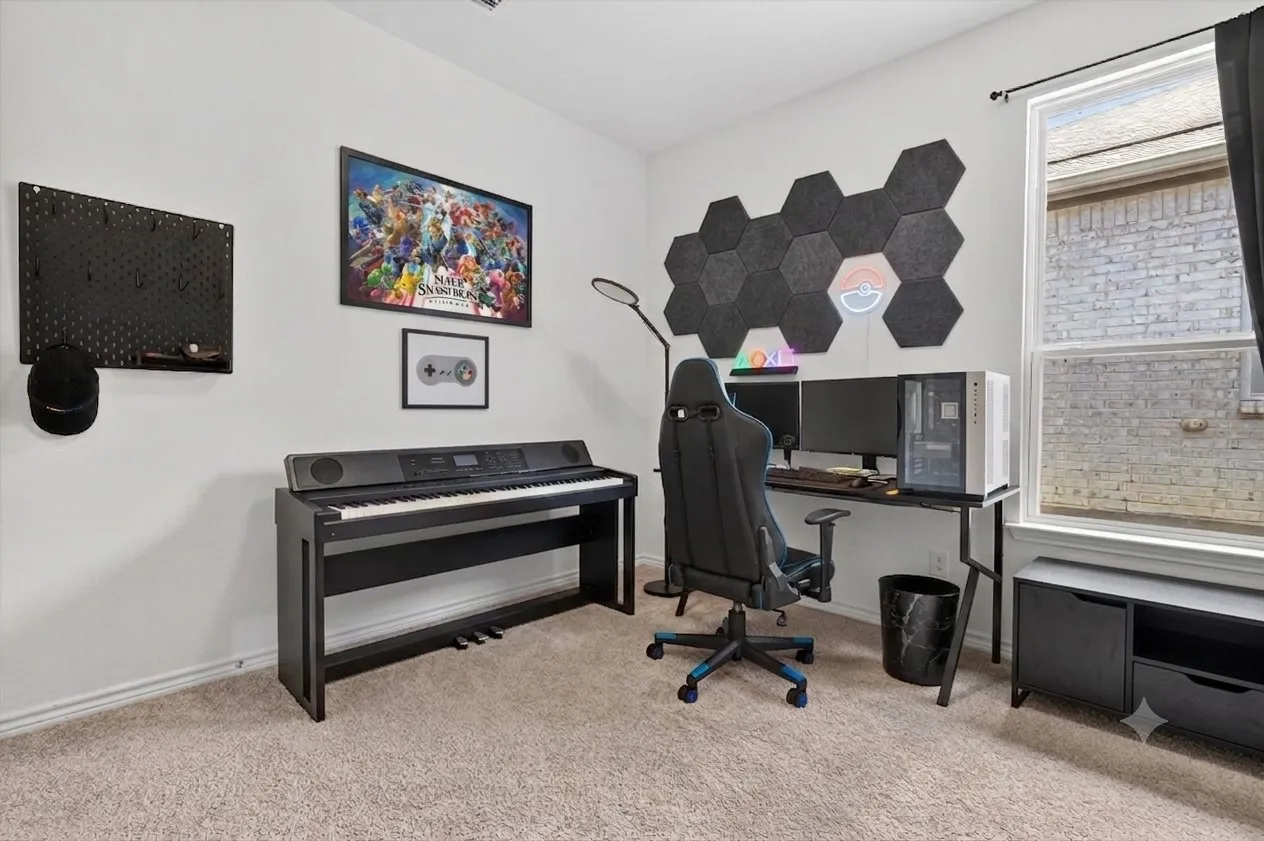 Carpeted room with white walls, featuring a large window with white framing, and a built-in shelf unit