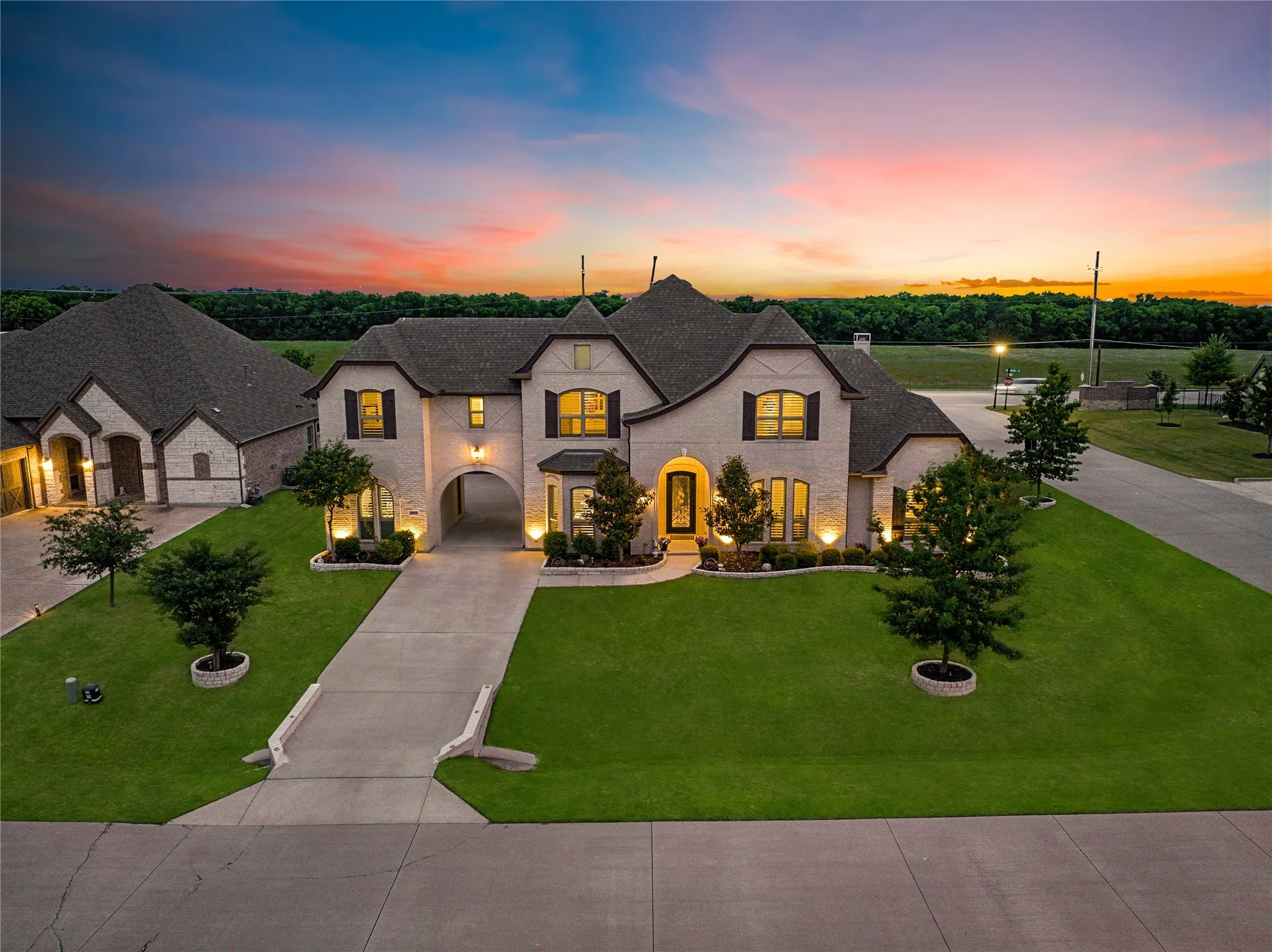 Stately brick exterior with dark trim accents and multiple gabled roofs