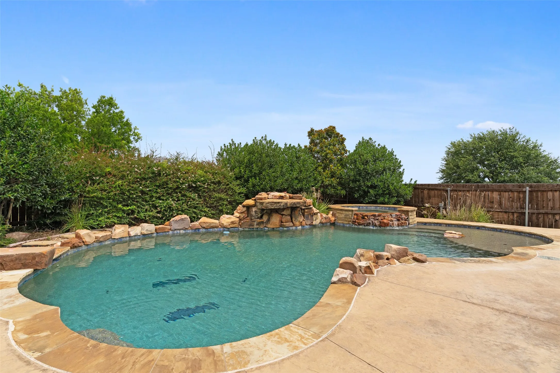 Diving rock, waterfall and hot tub.