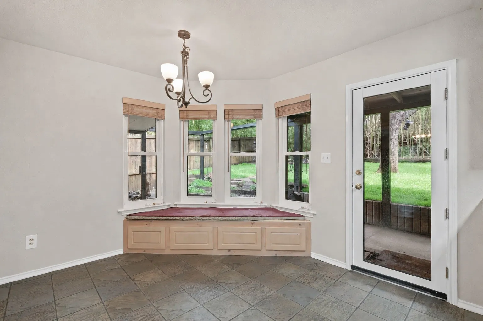 Breakfast nook in the eat in kitchen with access to the covered patio