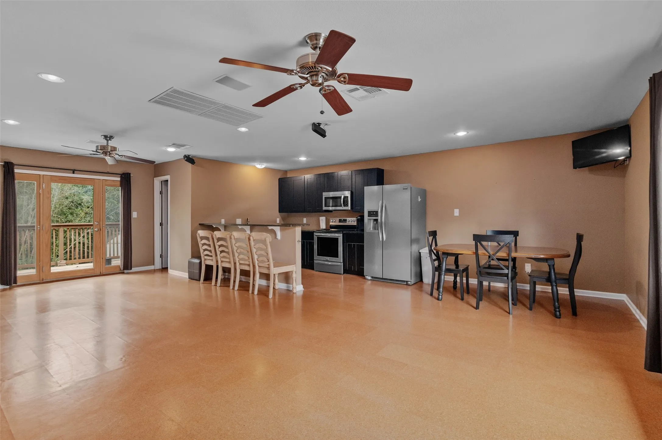 Income potential! Recently used as a game room this space has a  kitchen and full bath and could be used as a studio ADU