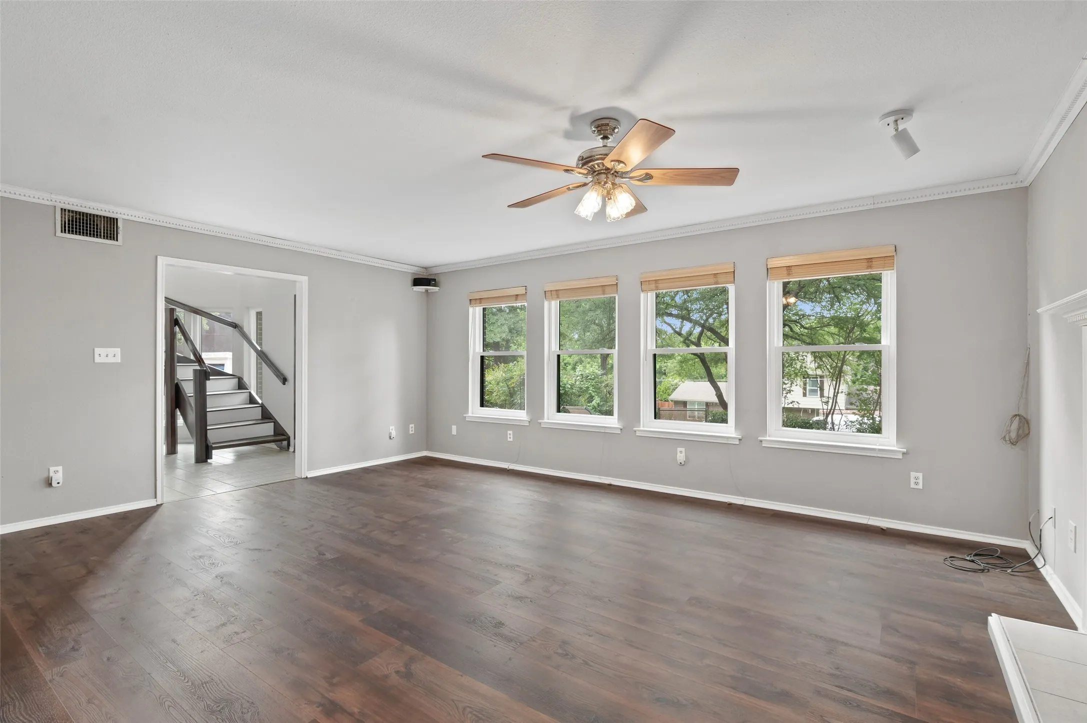 Living room with lots of natural light and brand new Pella windows!